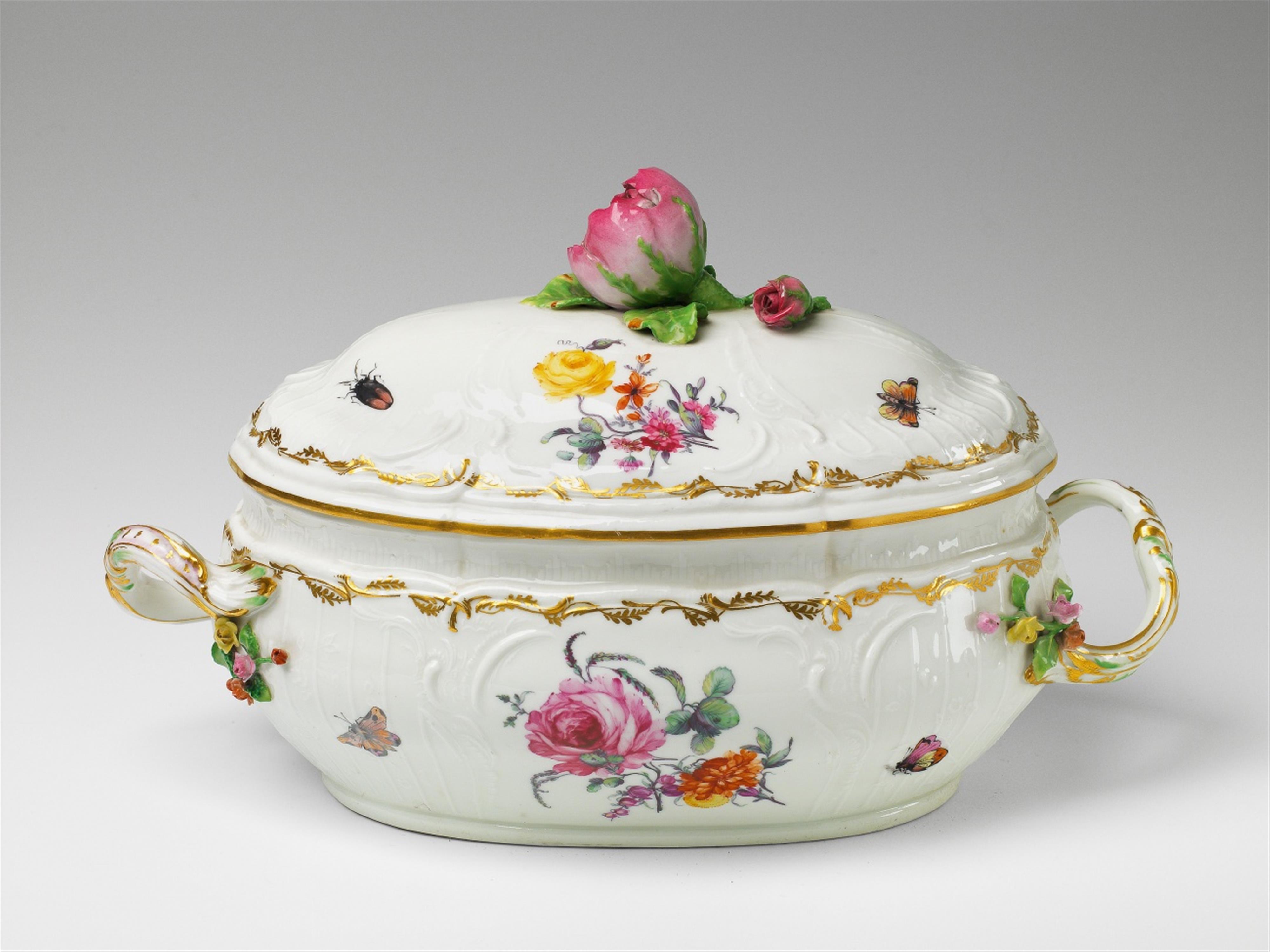 An oval Berlin KPM porcelain tureen with a rose finial - image-1