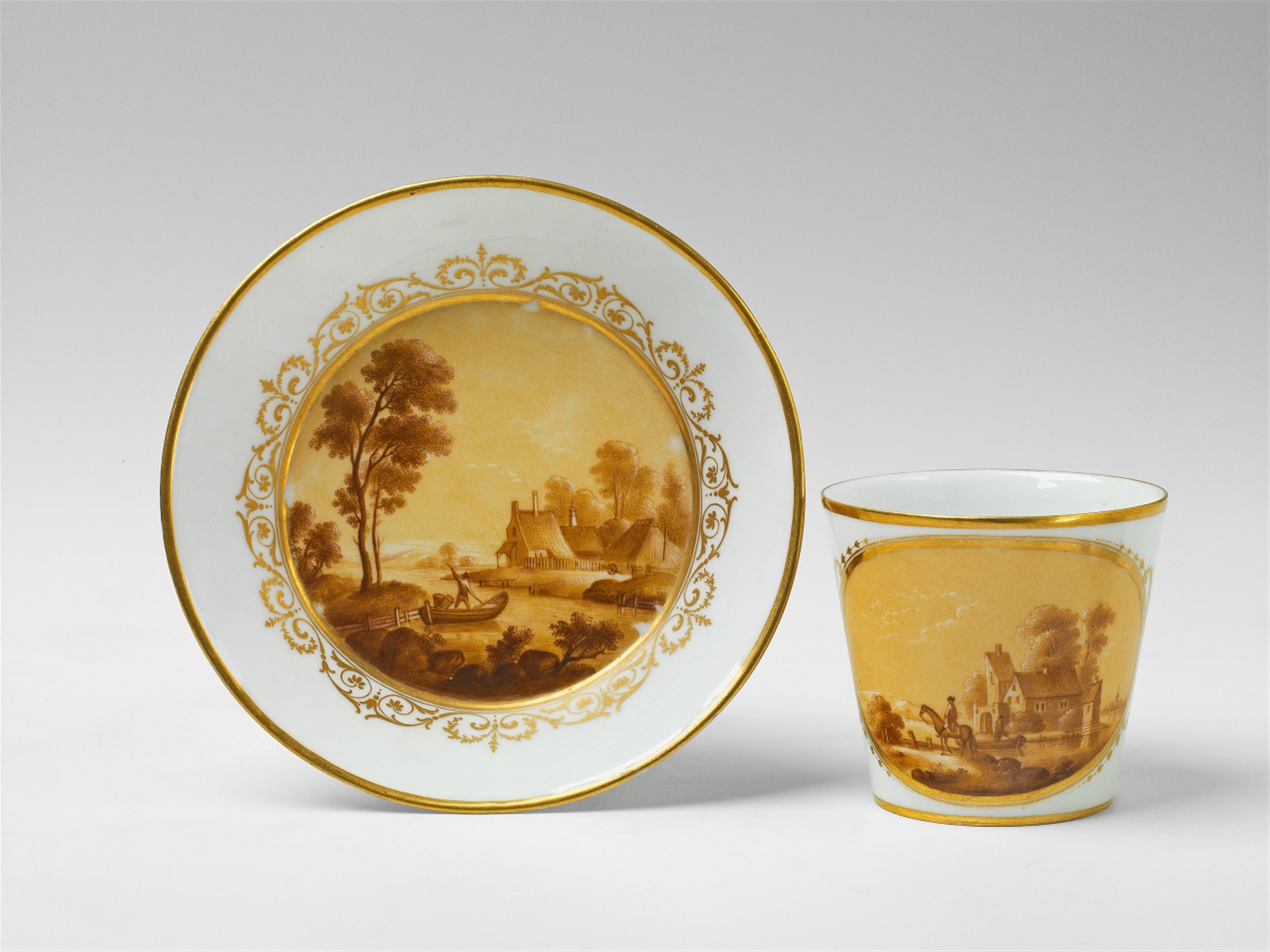 A Berlin KPM porcelain cup and saucer with river landscapes in sepia - image-1