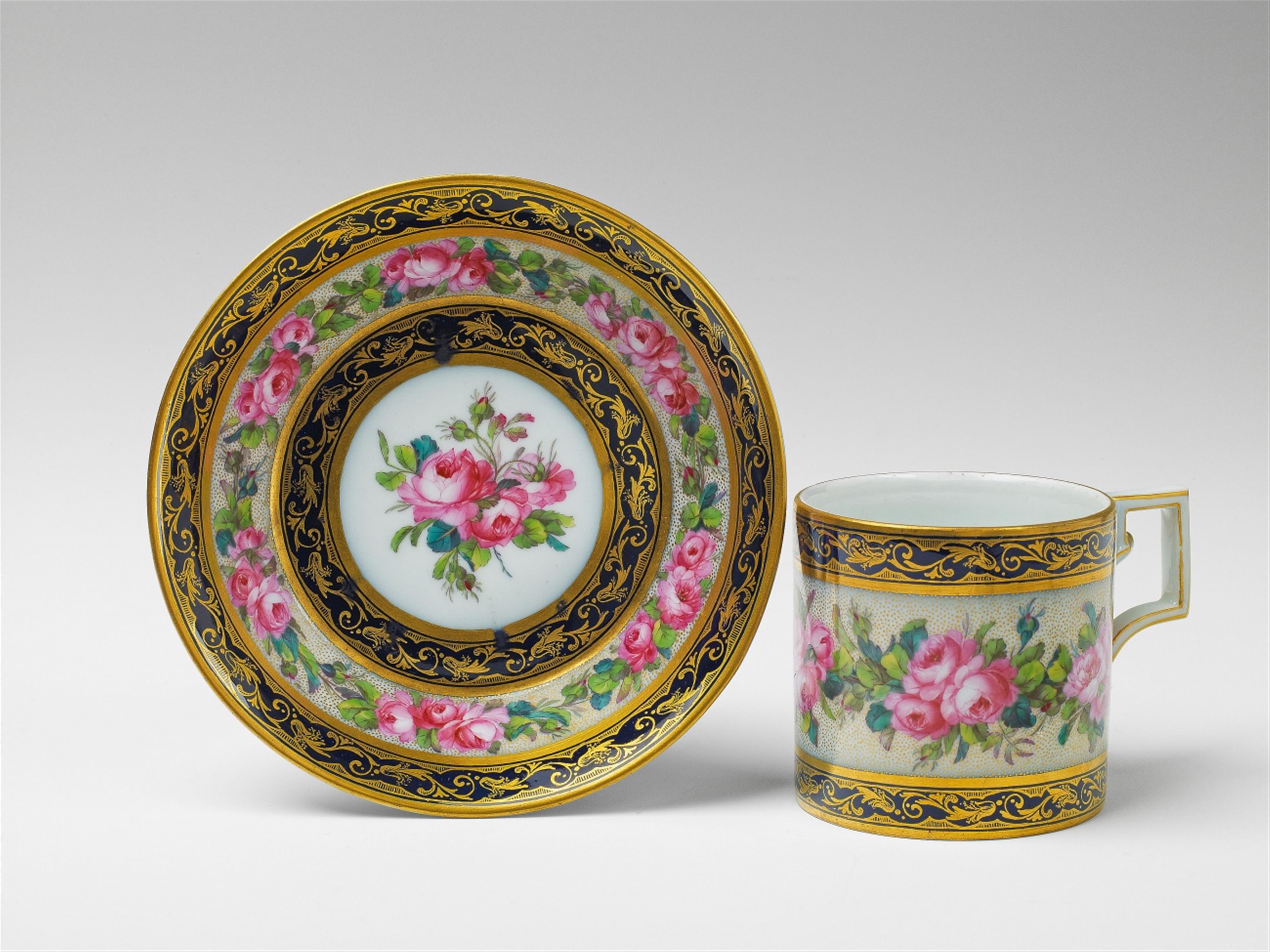 A Berlin KPM porcelain cup and saucer with rose decor - image-1