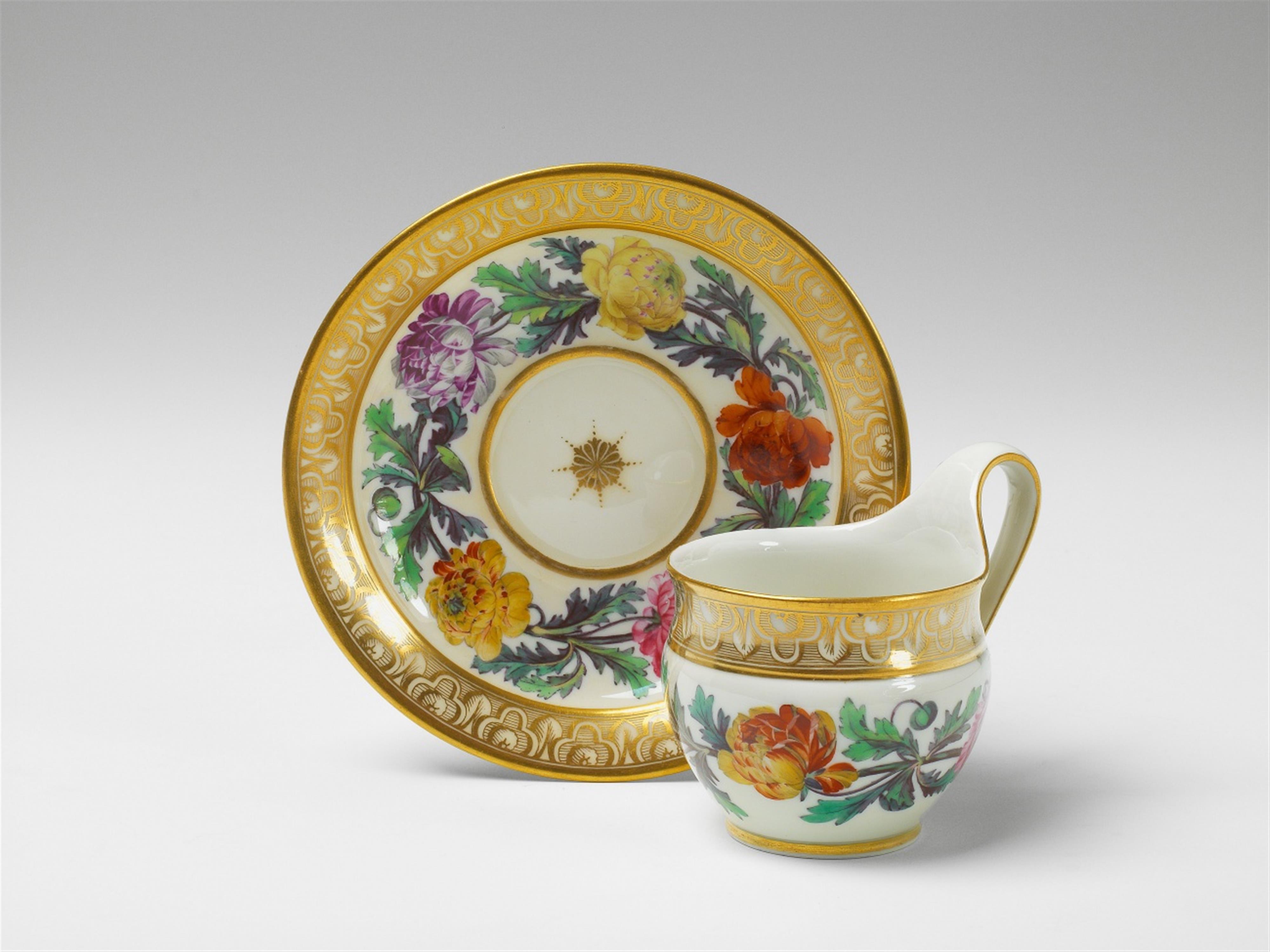 A Berlin KPM porcelain cup and saucer with Persian buttercup decor - image-1