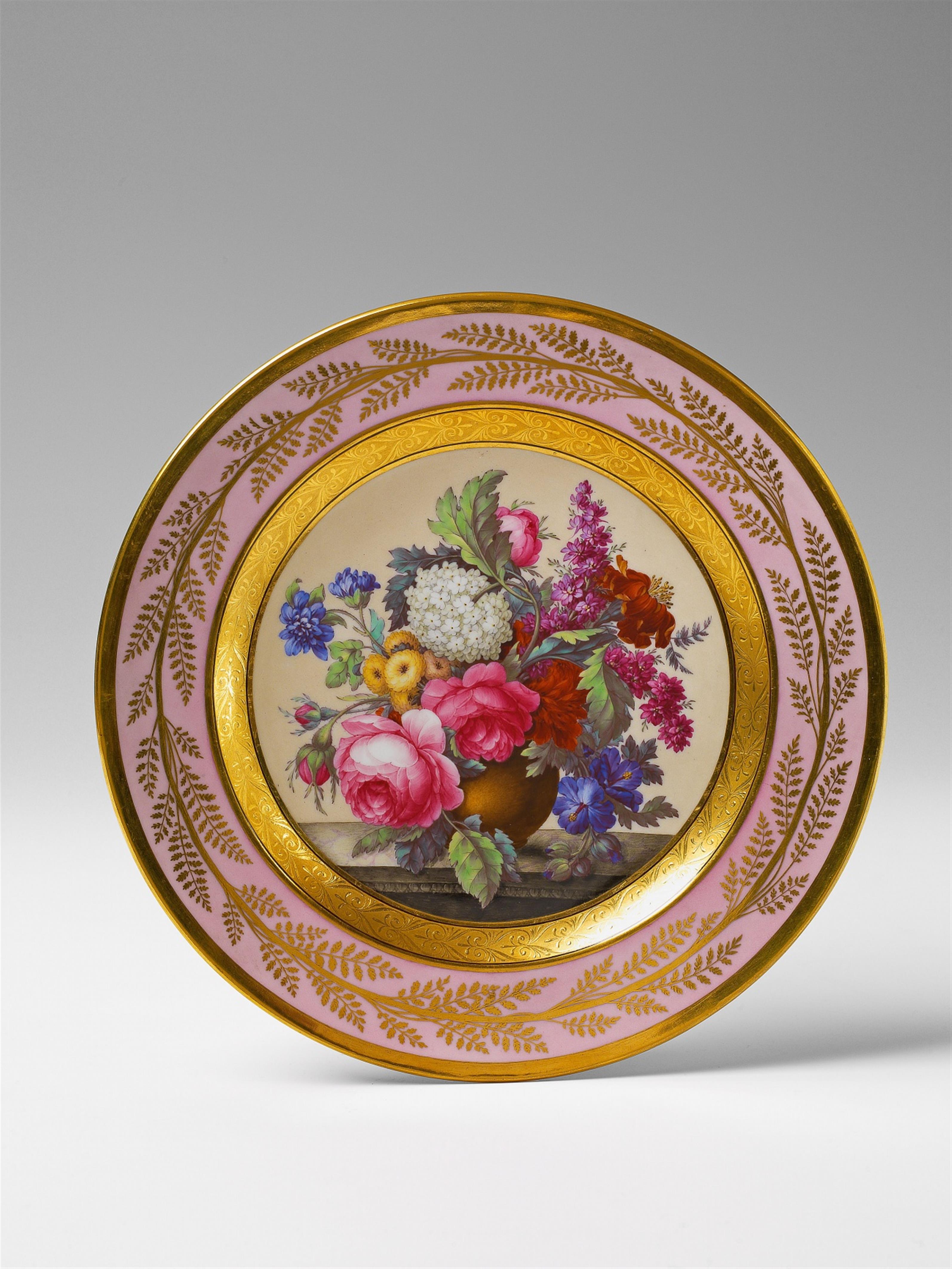 A Berlin KPM porcelain plate with a floral still life - image-1