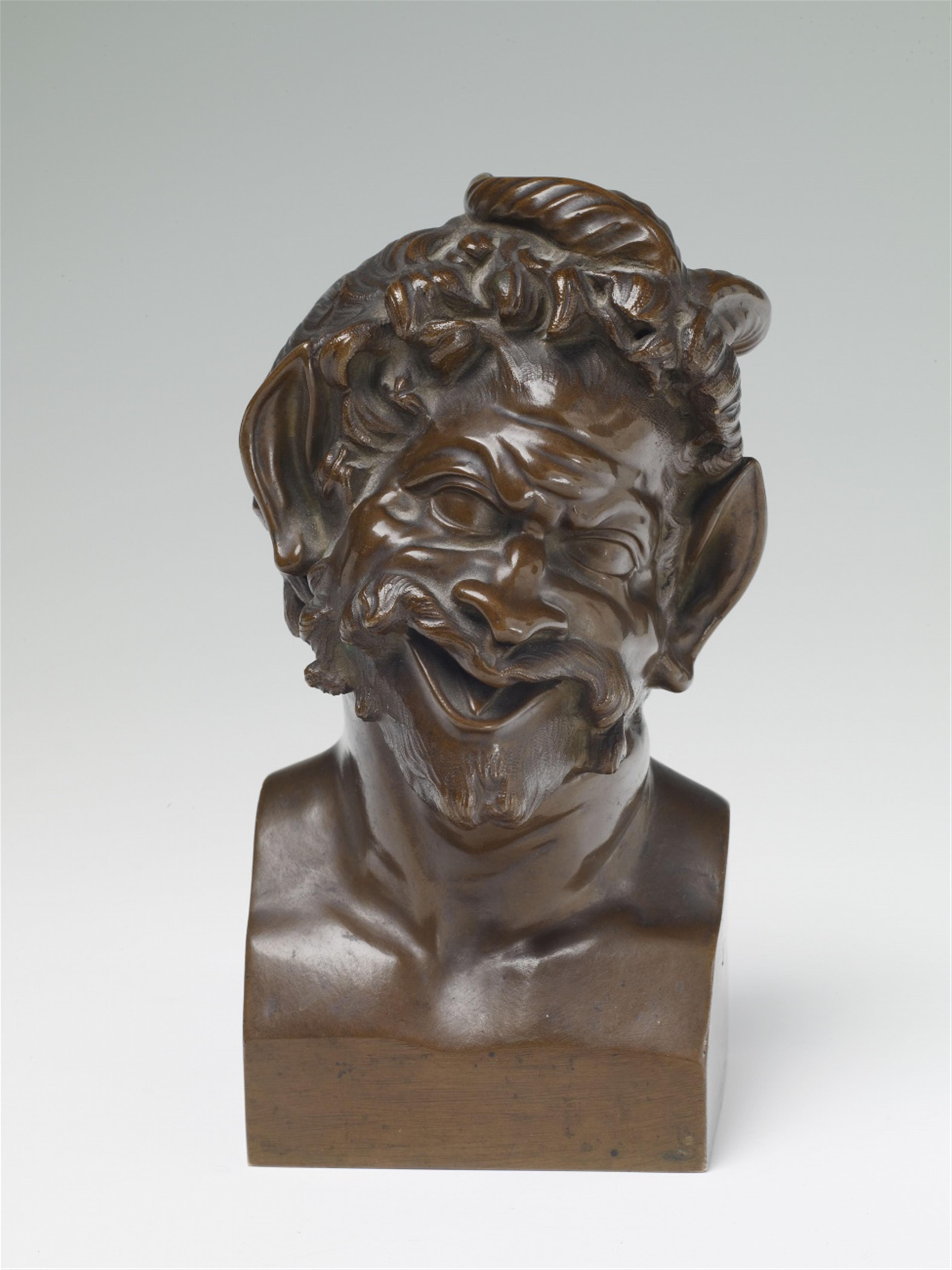 A bronze bust of a laughing satyr - image-1