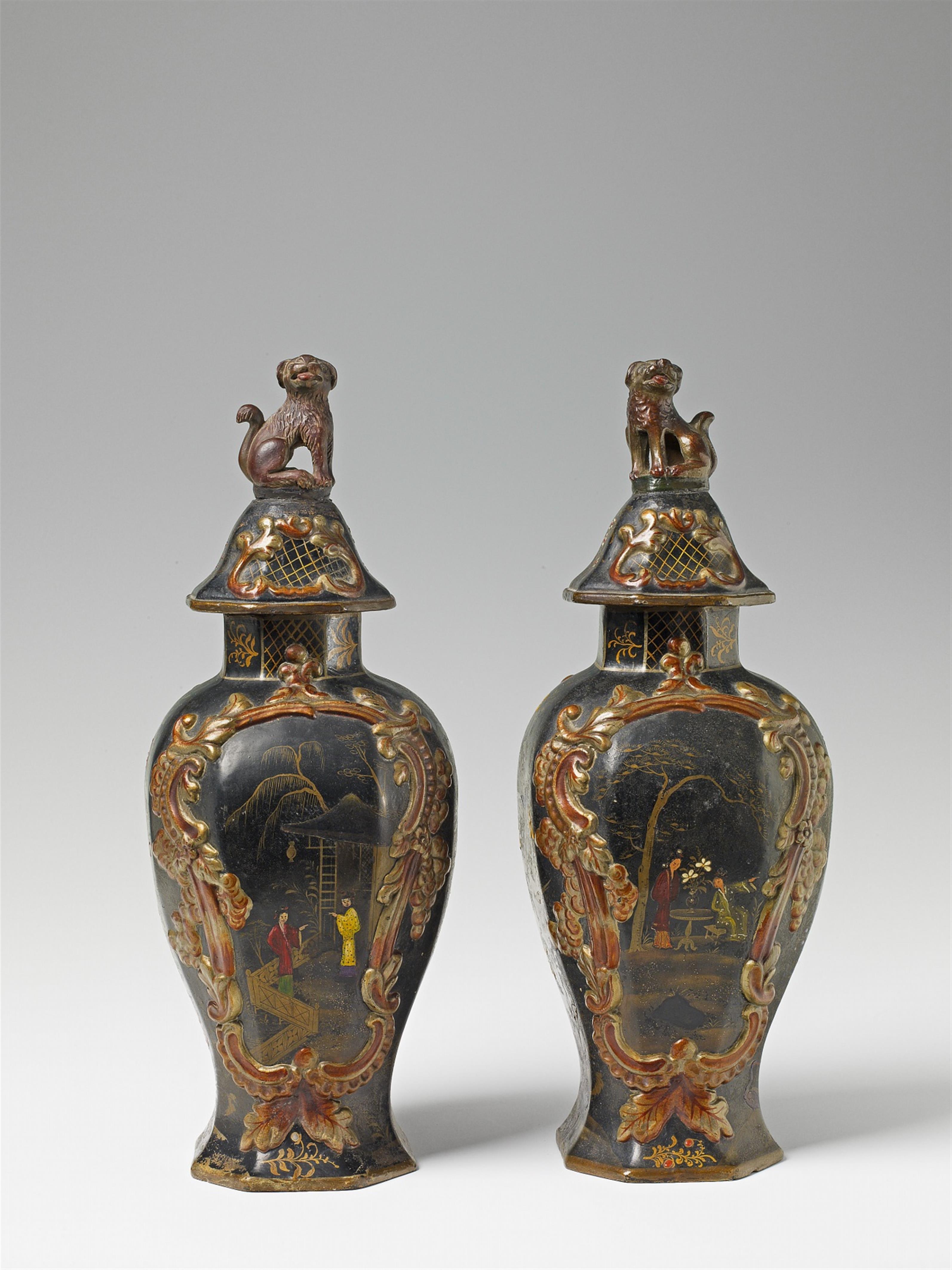 A pair of covered faience vases with lacquer decor on black ground - image-1