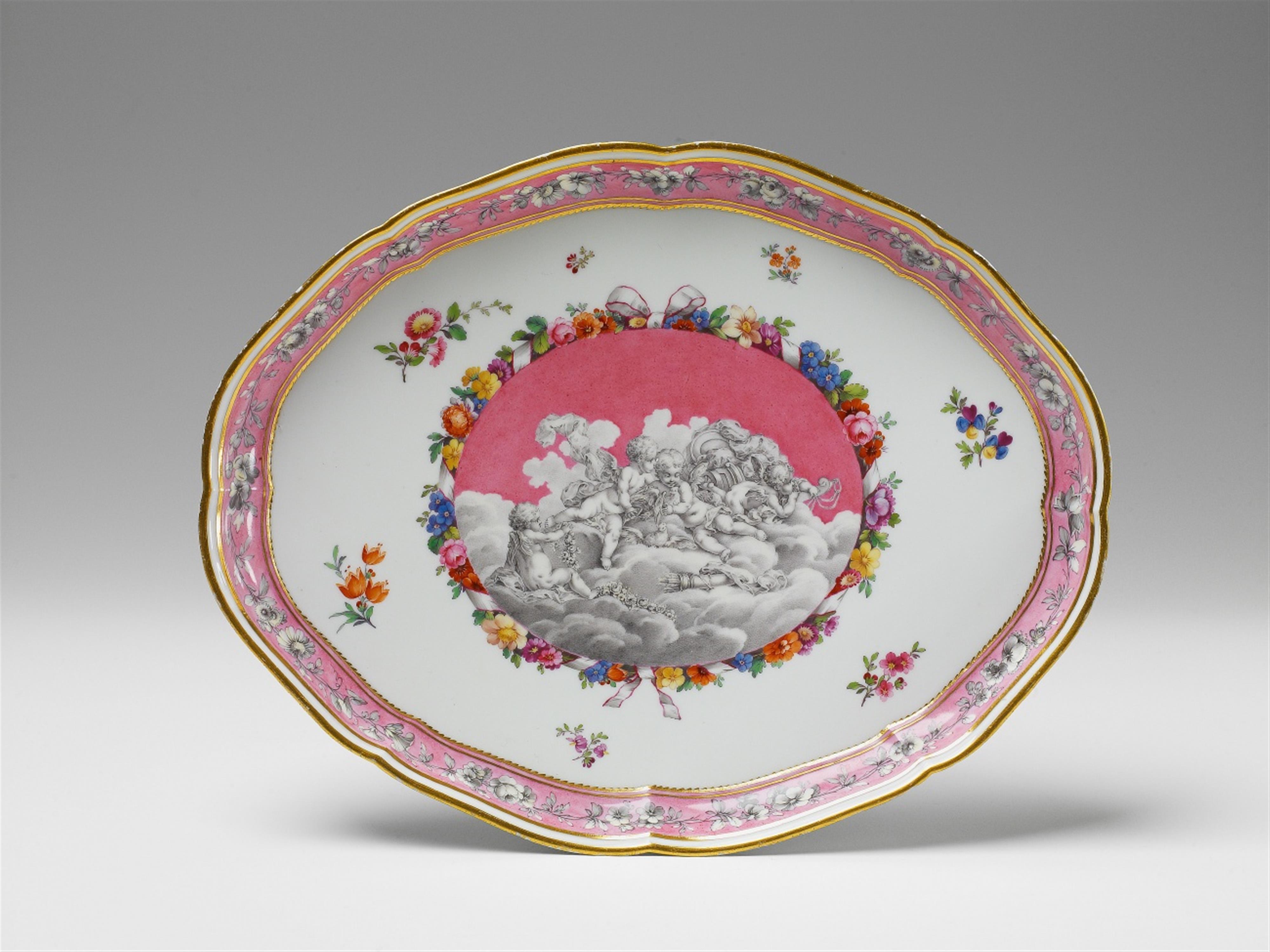 A Berlin KPM porcelain platter with putti in grisaille - image-1