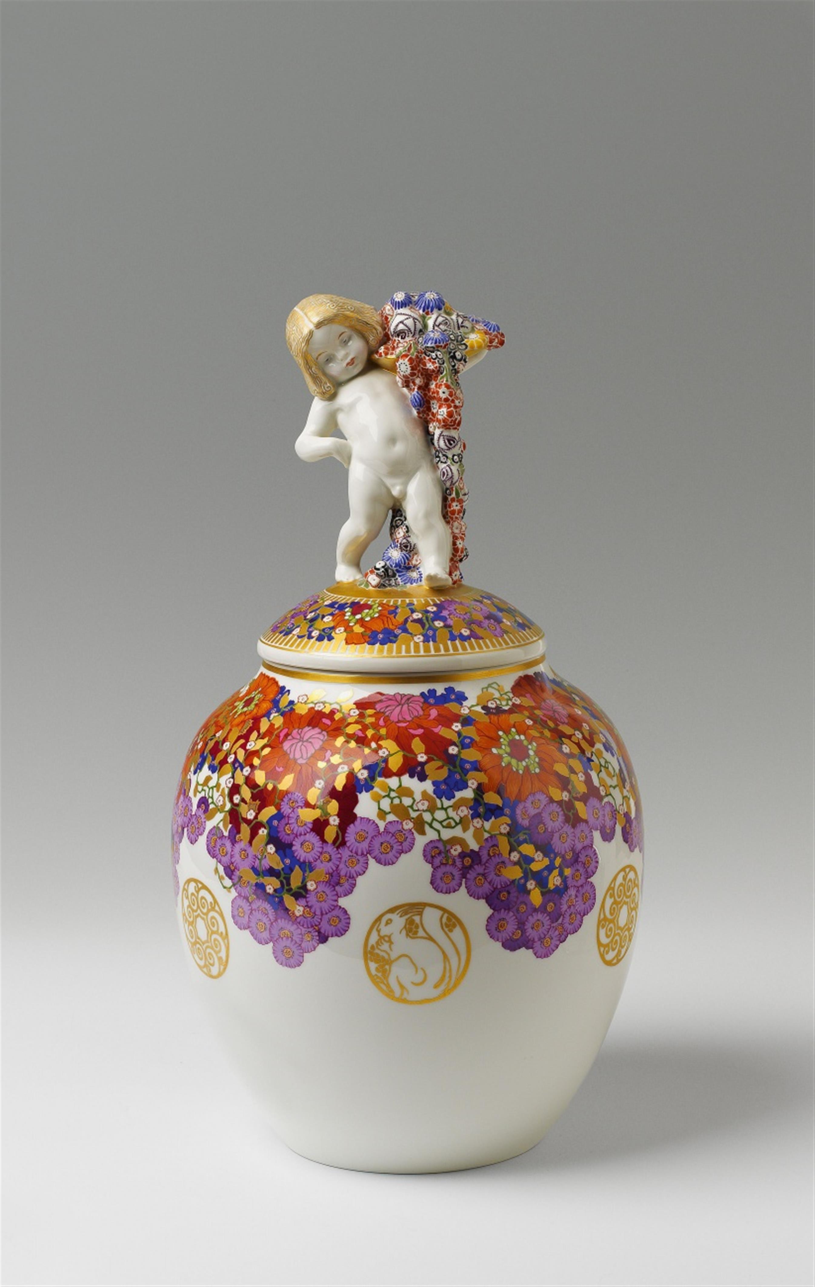 A large Berlin KPM porcelain vase and cover with a putto finial - image-1