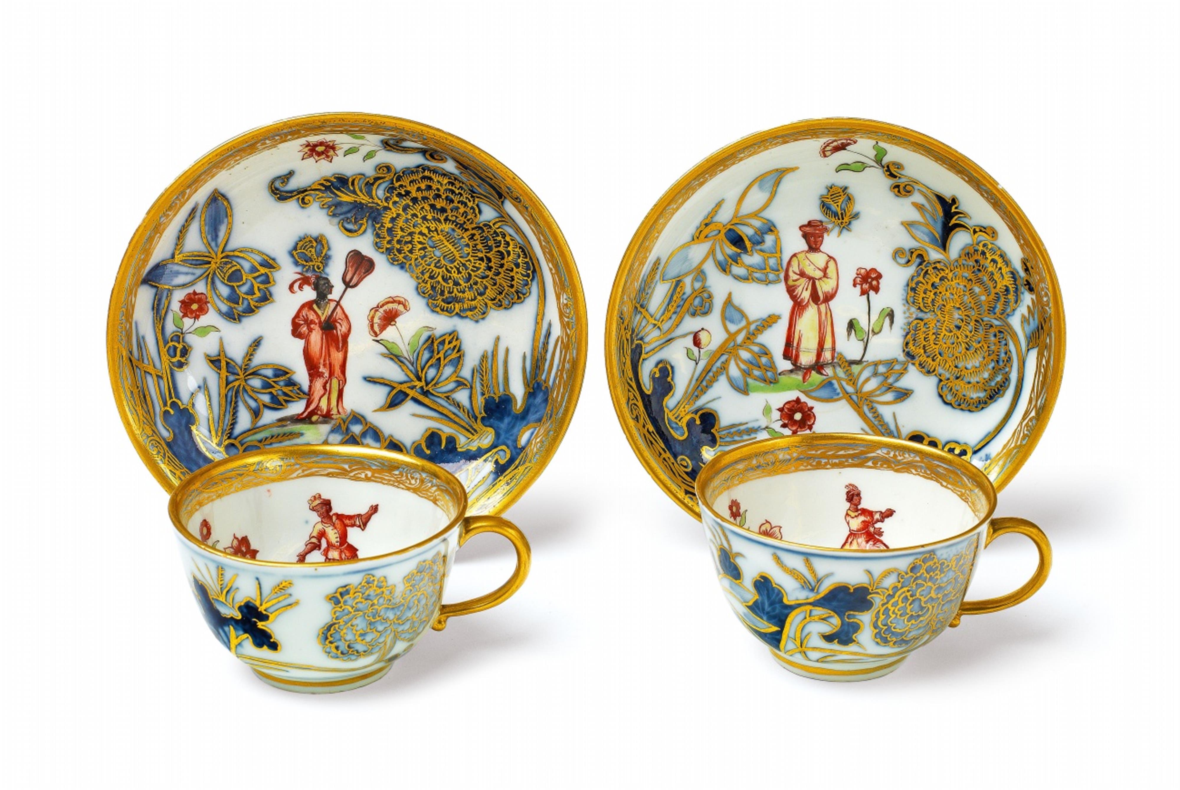 A pair of Meissen porcelain cups and saucers with "hausmaler" decor - image-1