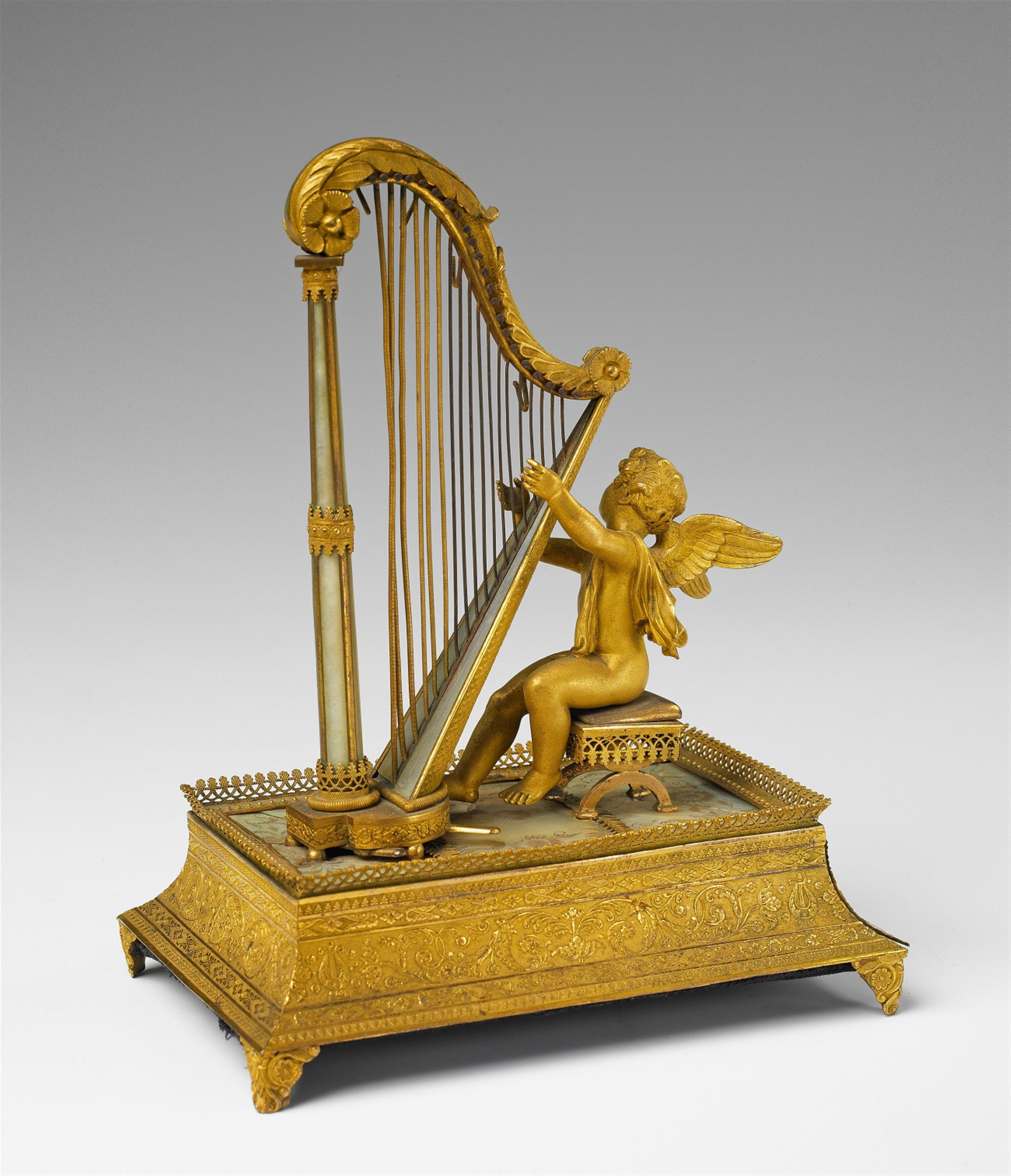 A fire-gilt bronze musical box formed as a putti playing a harp - image-3