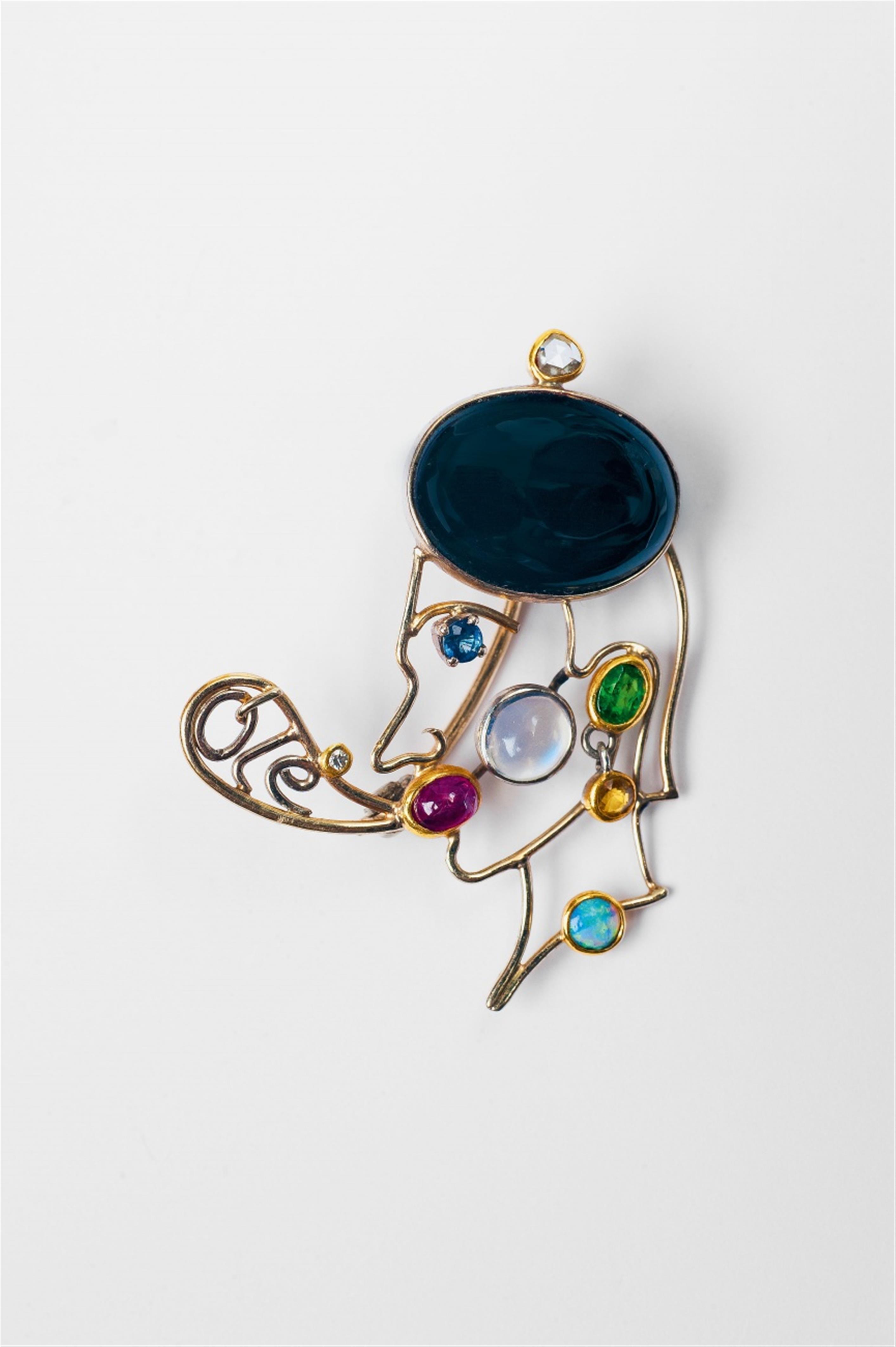 An 18k gold gem-set brooch of a male head with speech bubble by Falko Marx, Cologne - image-2