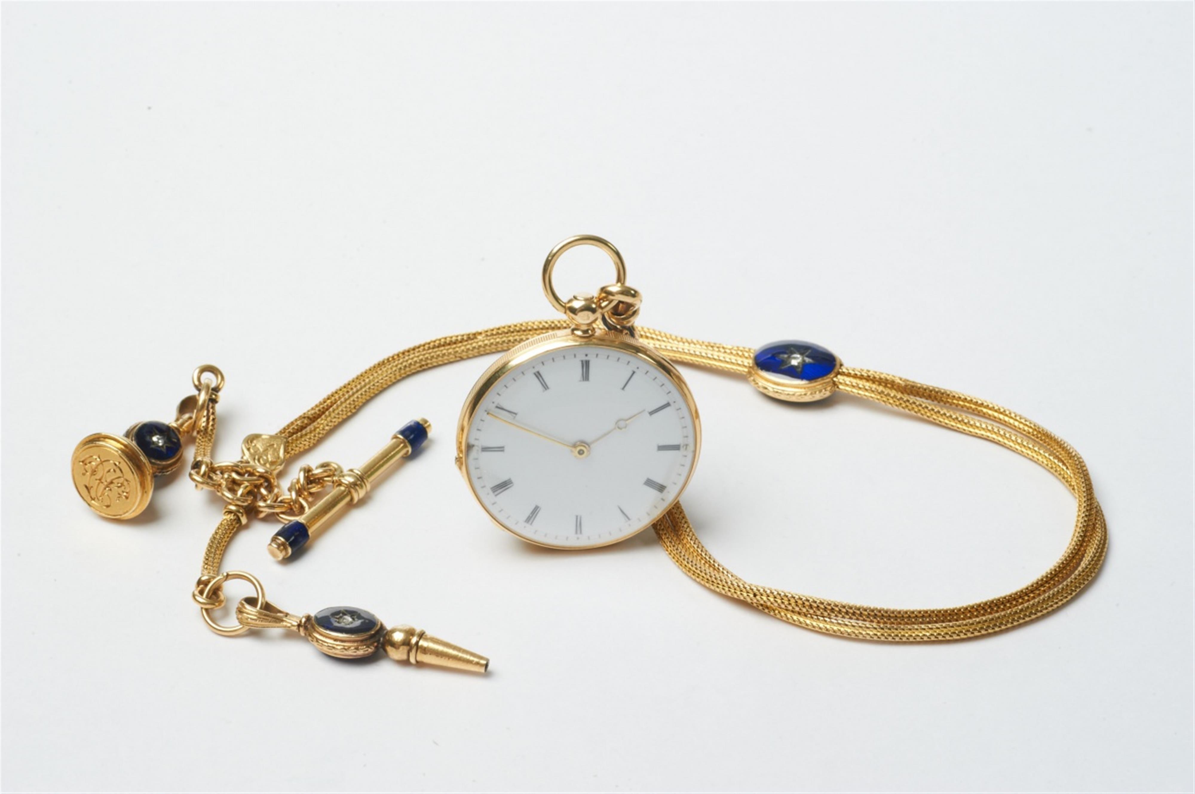 A French 18k gold and lapislazuli openface pendant watch with cylinder escapement. Gold, enamel and diamond watch chain with key and seal. - image-1