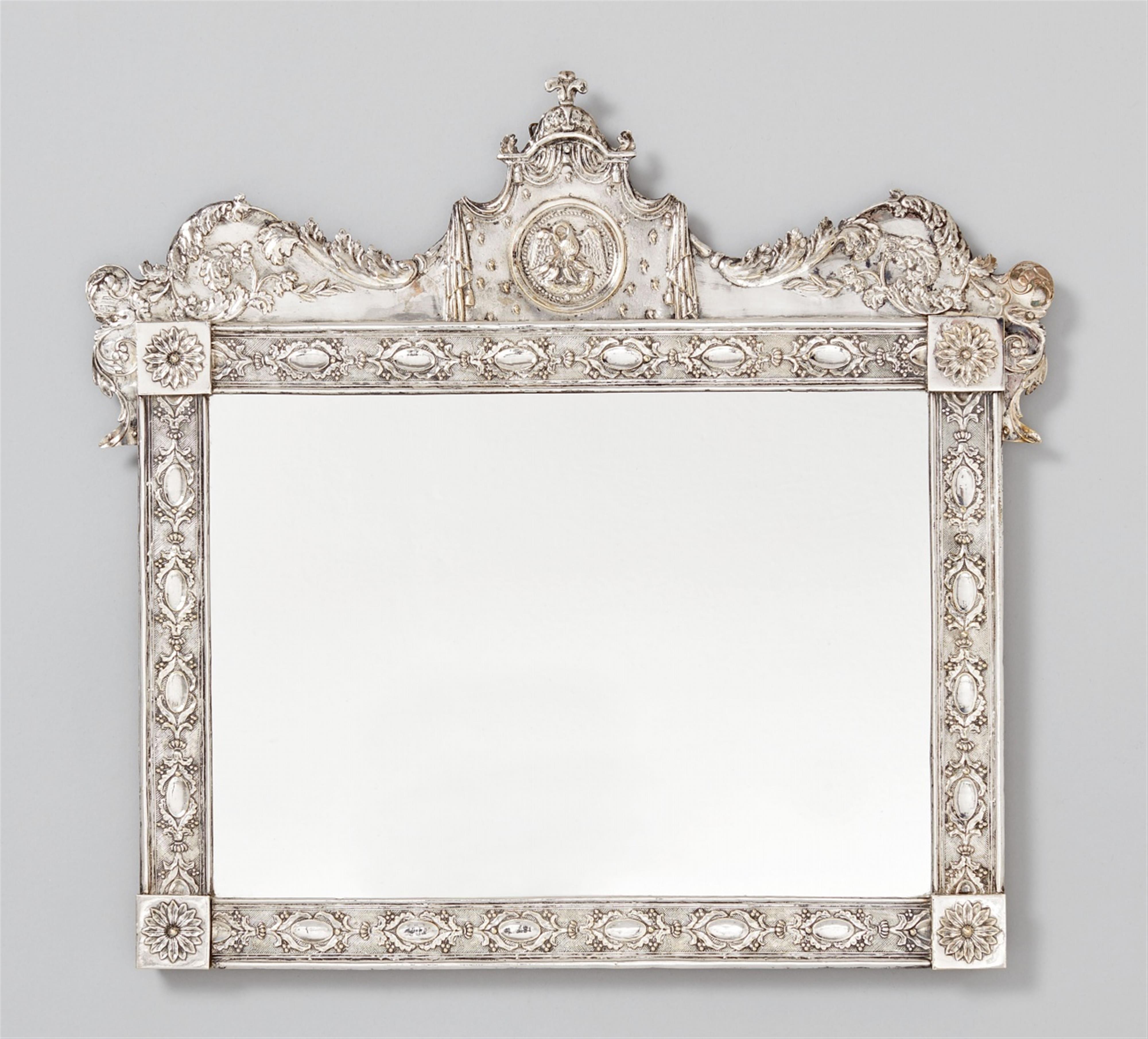 A silver frame. Worked over a wooden corpus, with modern mirror plate. Unmarked, probably German, late 18th C. - image-1