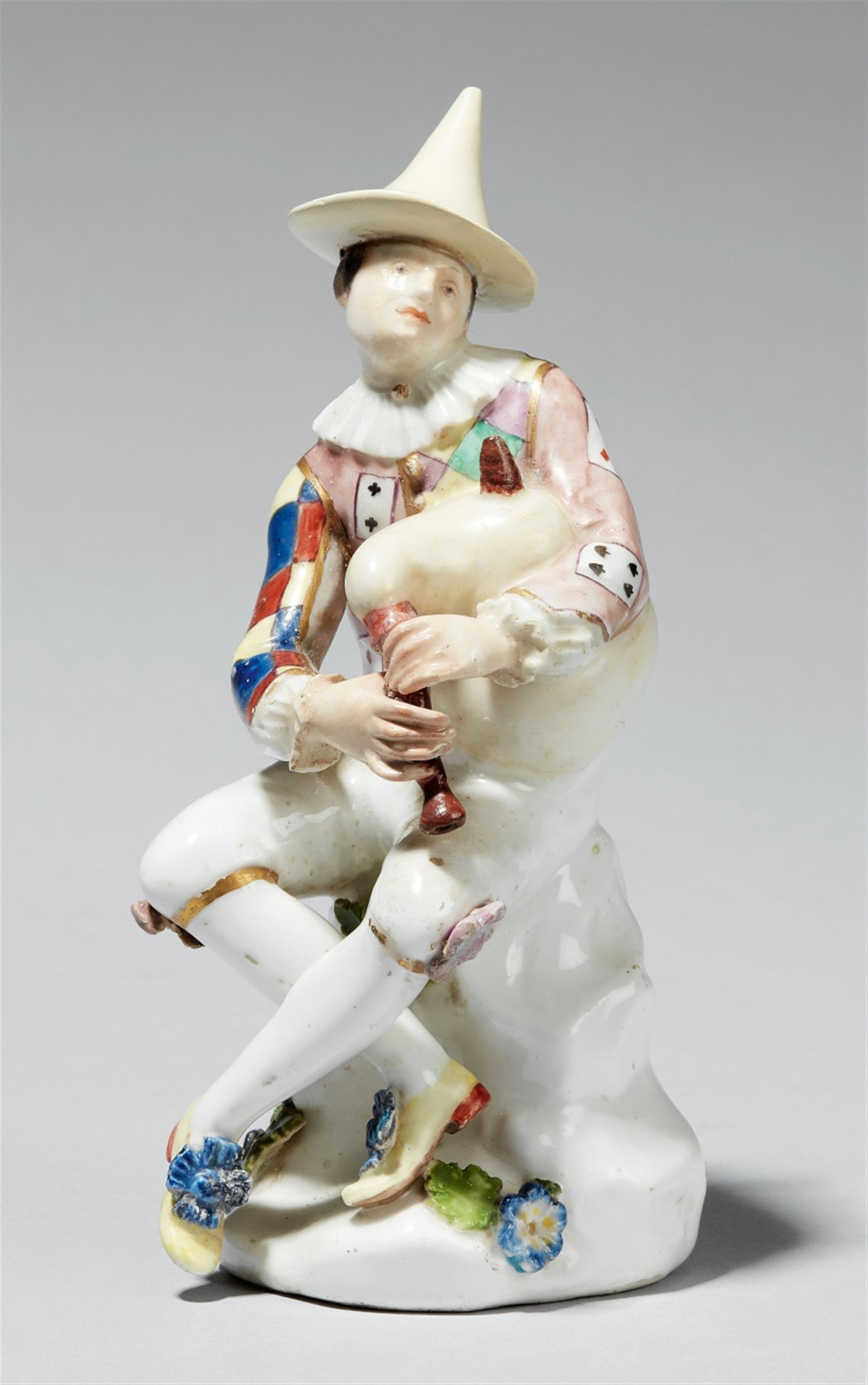 A Meissen porcelain figure of harlequin playing bagpipes - image-1