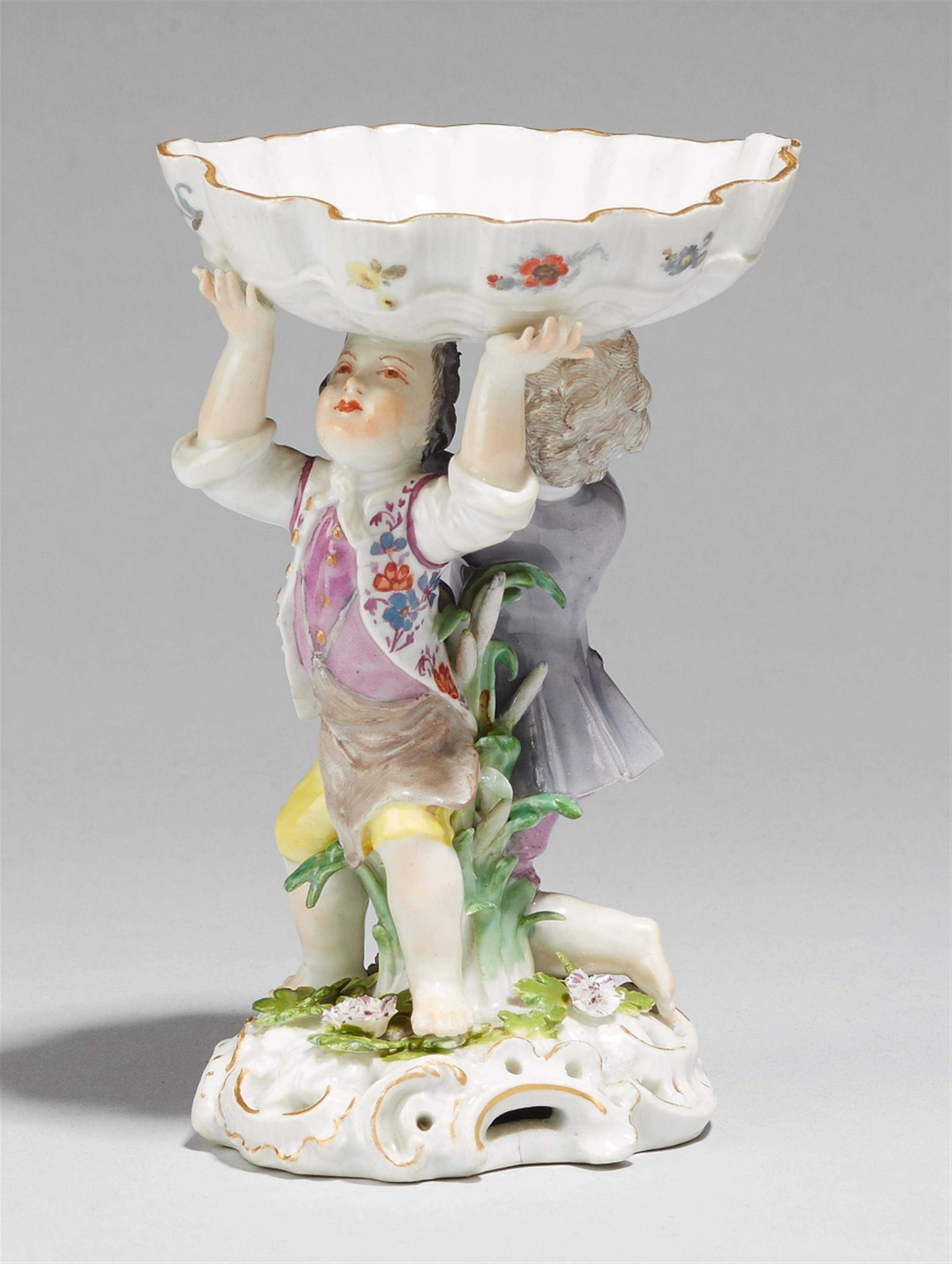 A Meissen porcelain salt formed as two youths supporting a dish - image-1