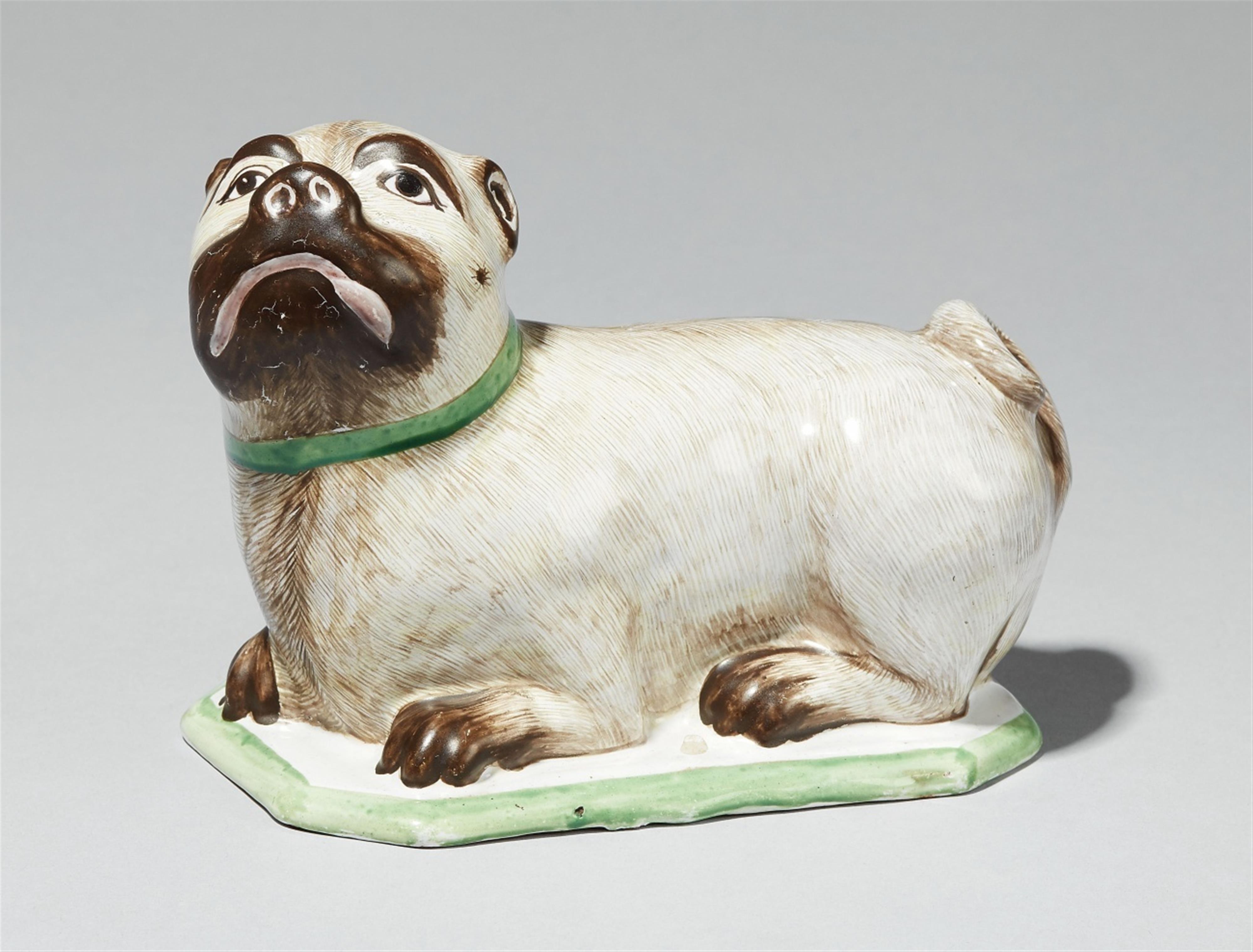 A rare German faience model of a recumbent pug dog - image-1