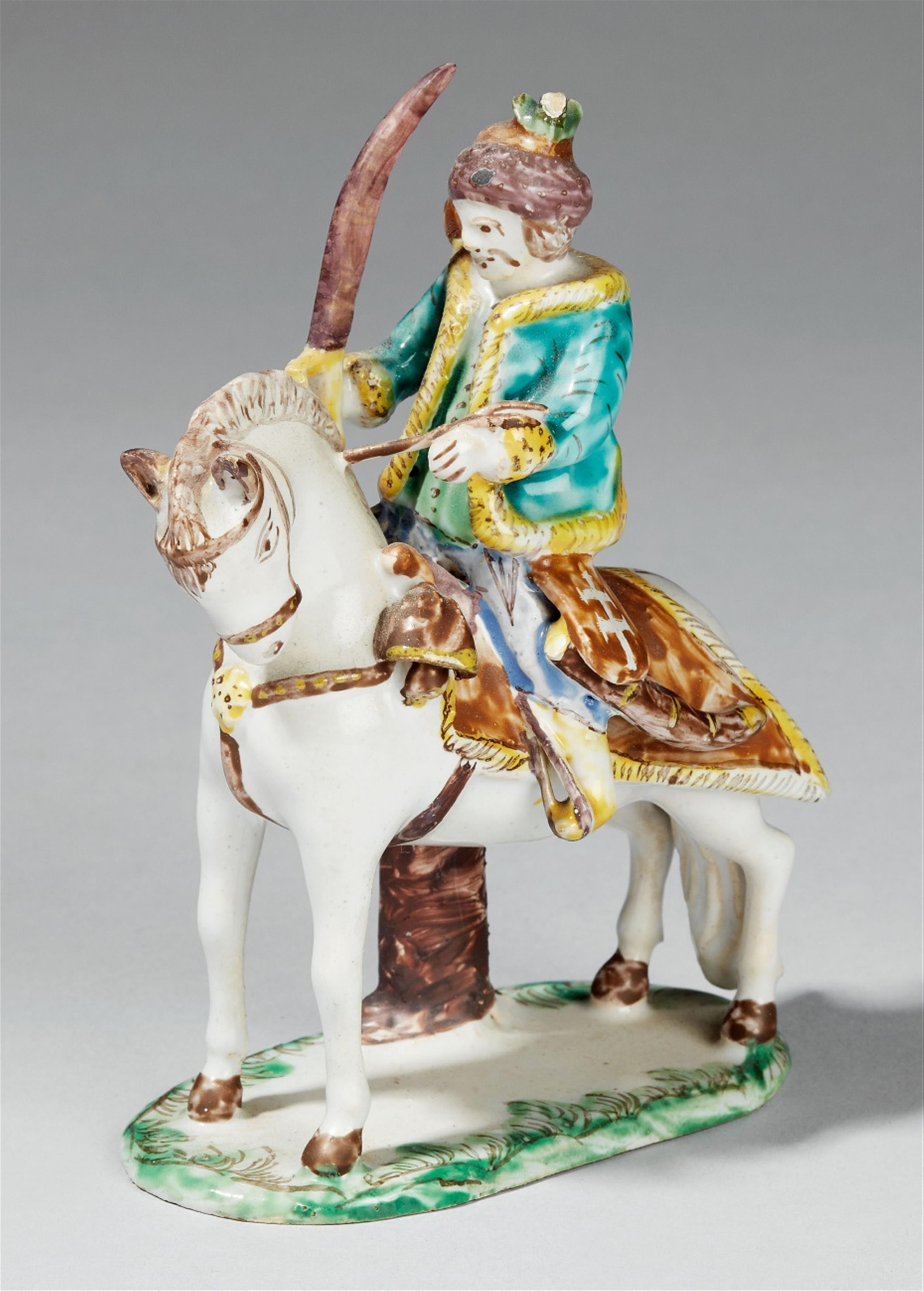 A Hungarian faience figure of a mounted Hussar - image-1