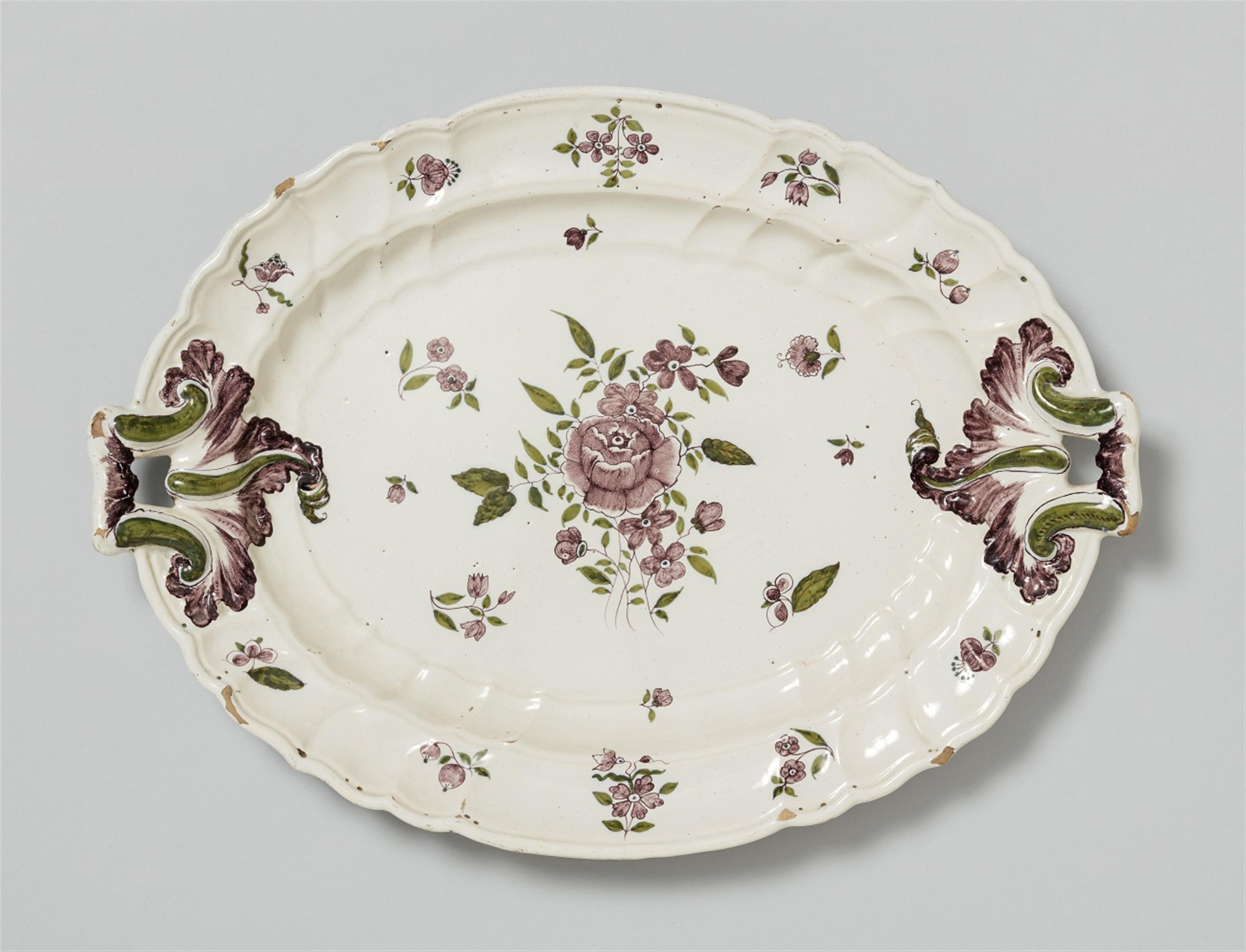 A Magdeburg bicolour faience platter painted with a rose - image-1