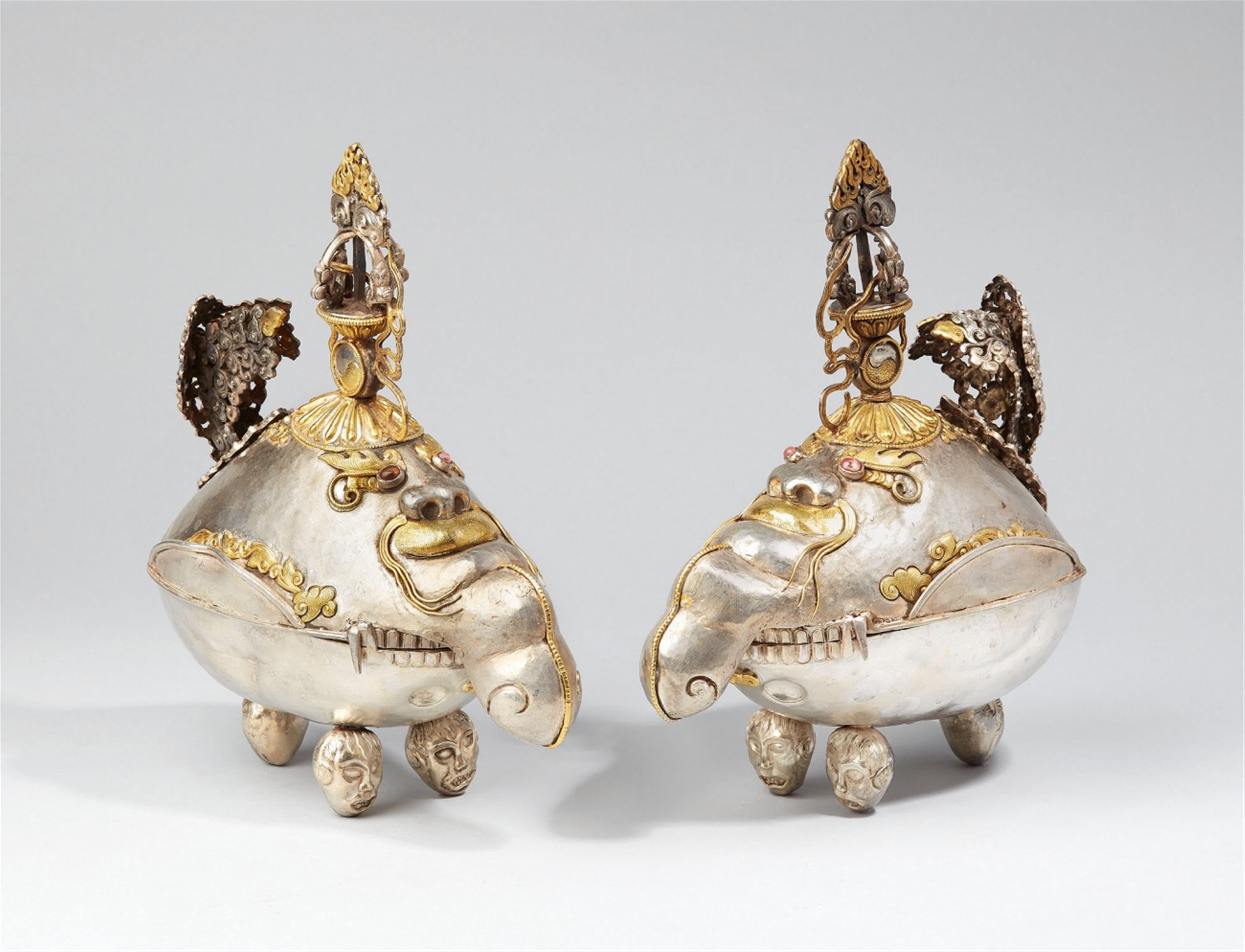 A pair of Tibetan silver kapala with cover in the shape of a makara-head - image-1