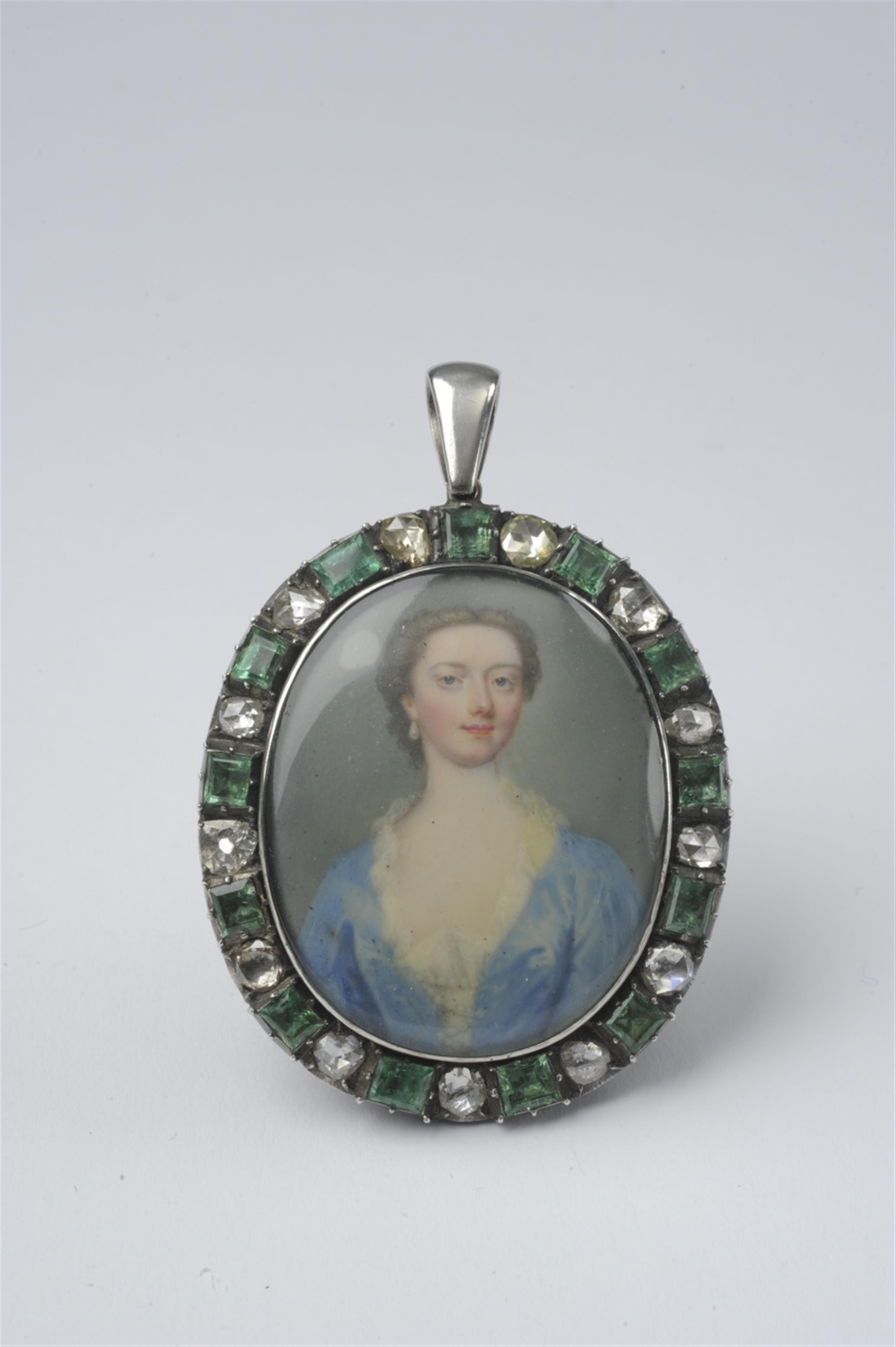 A silver pendant with a portrait miniature - image-1