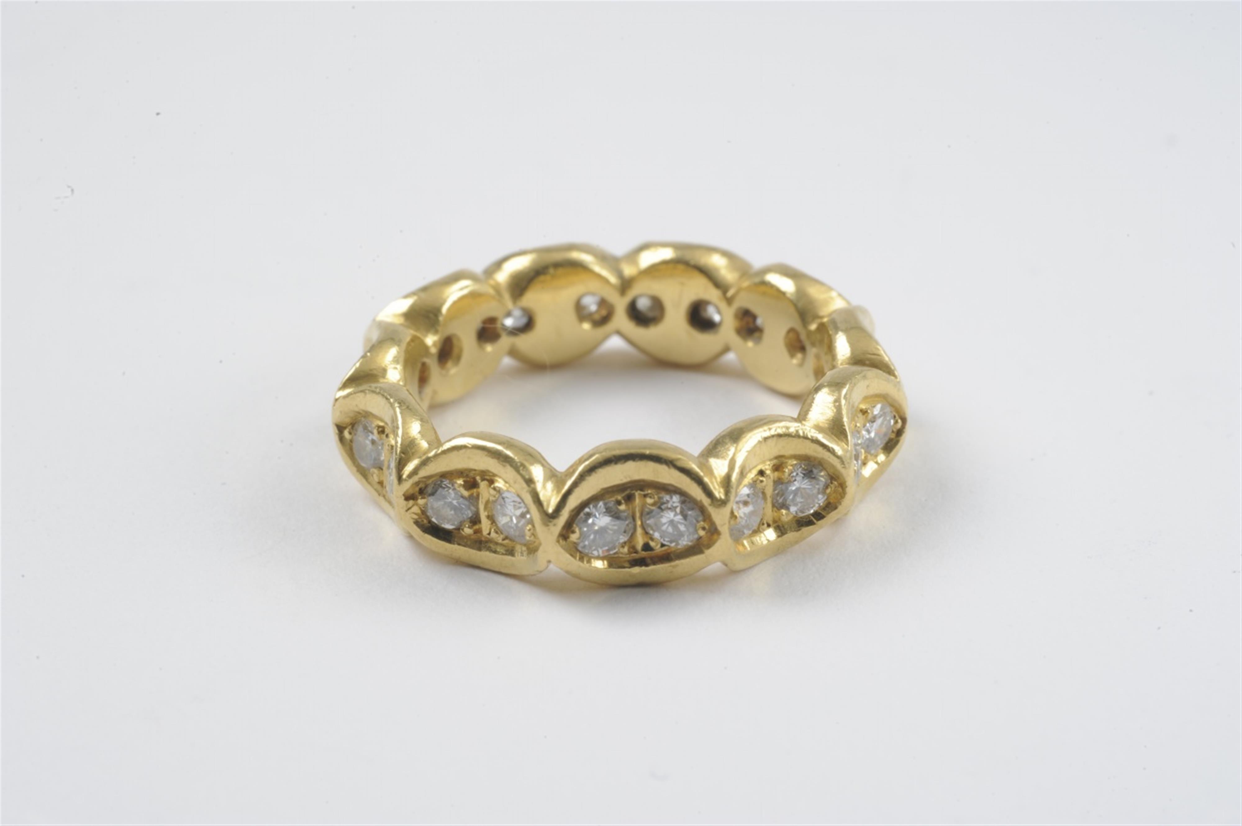 A 21k gold and diamond eternity ring - image-1