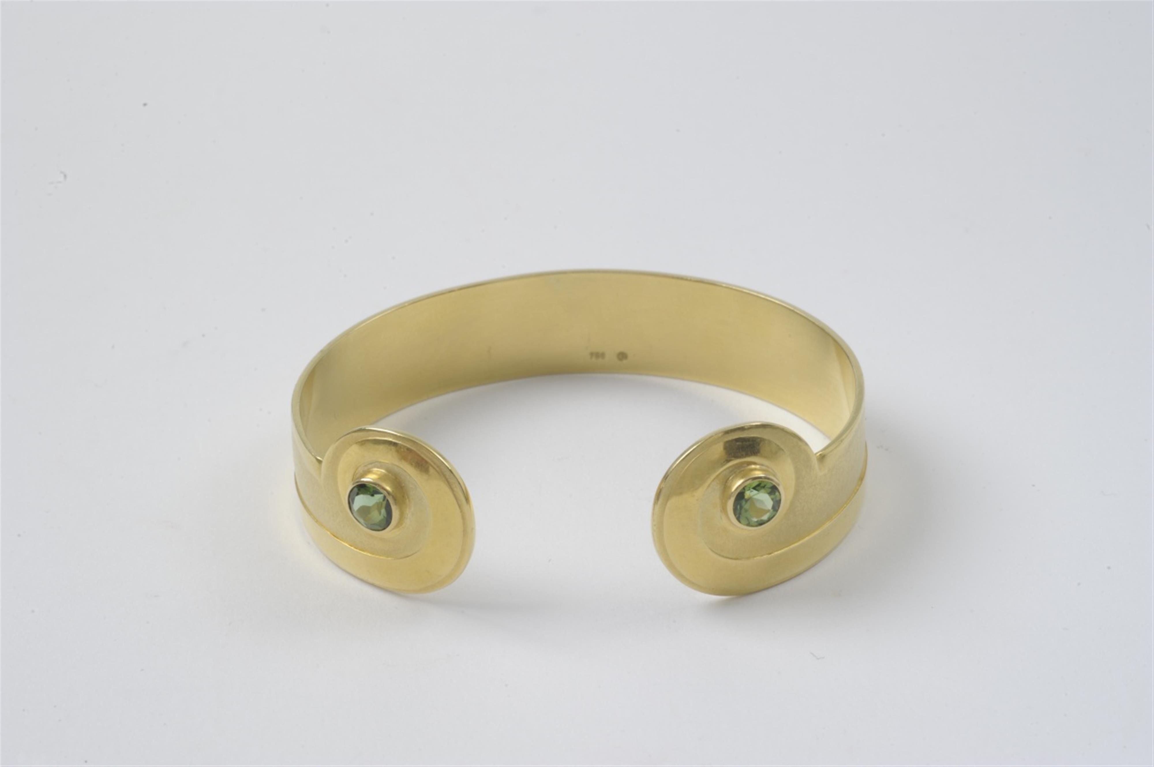 An 18k gold and tourmaline bangle - image-1