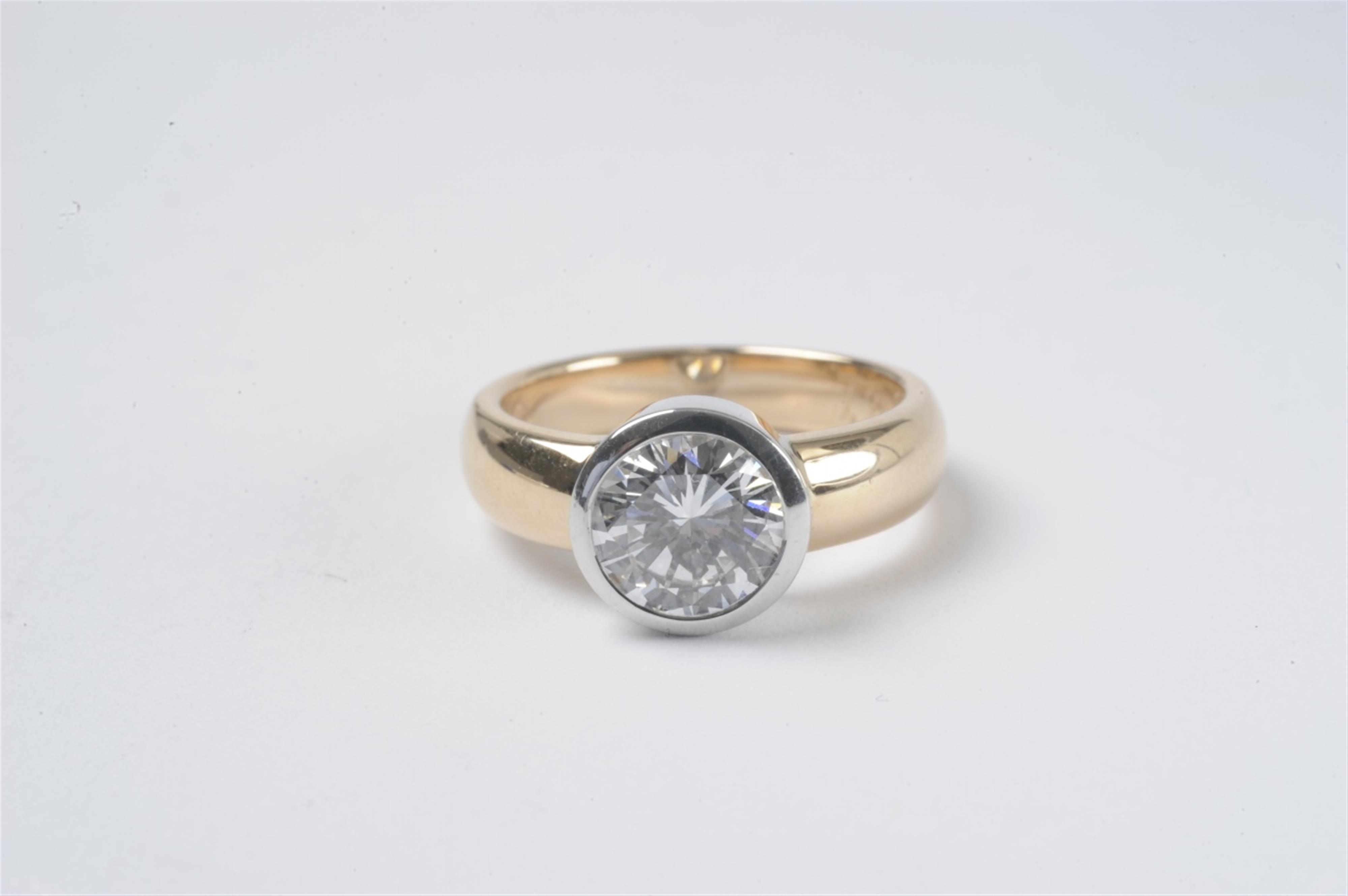A 14k red and white gold diamond solitaire ring - image-1