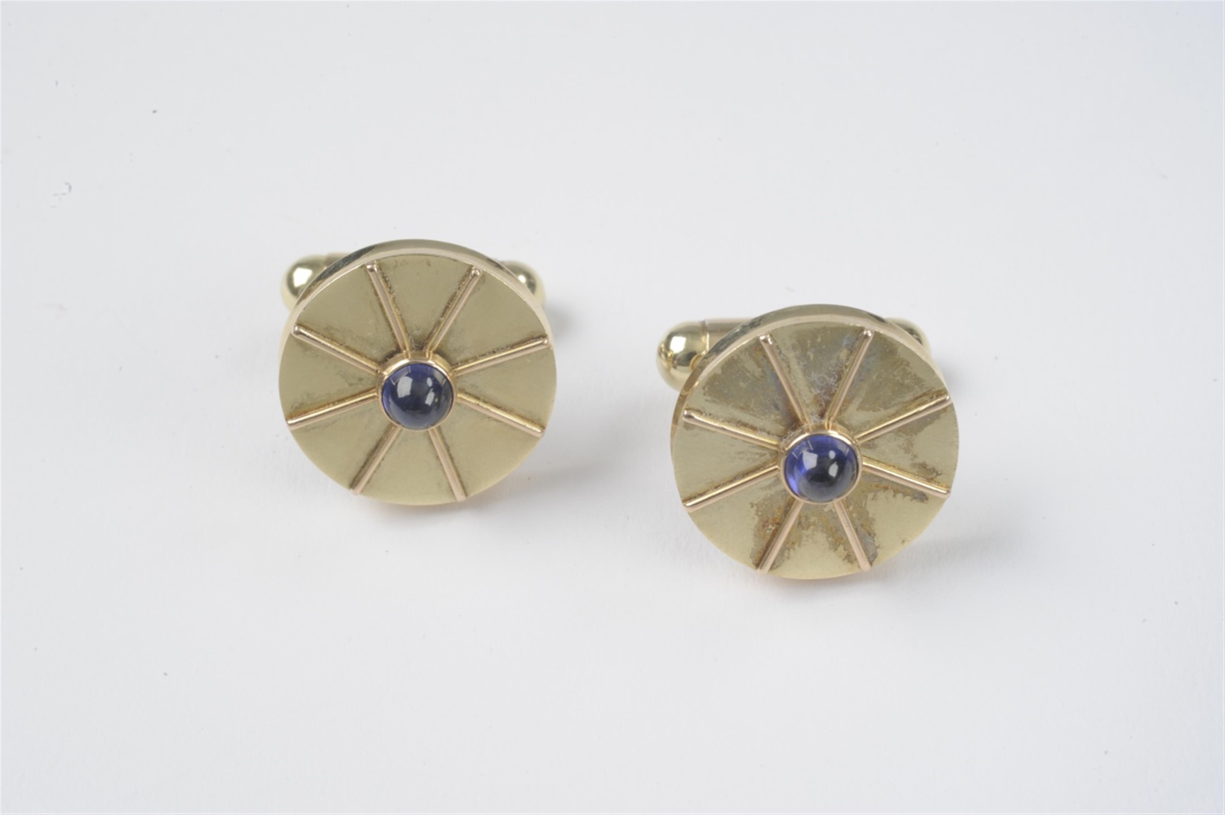 A pair of 18k gold and sapphire cufflinks - image-1