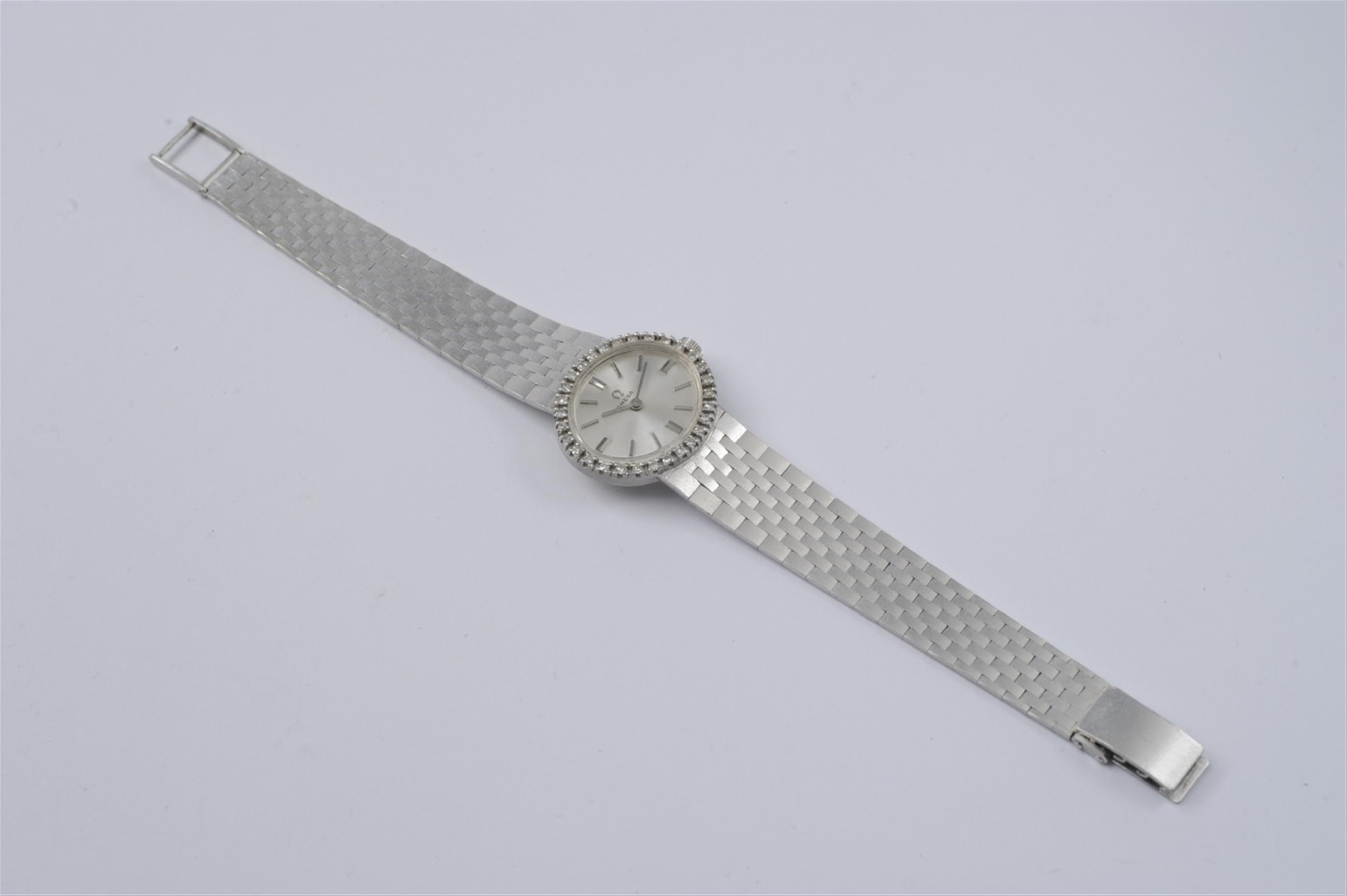 An Omega 18k white gold and diamond ladie's cocktail wristwatch - image-1