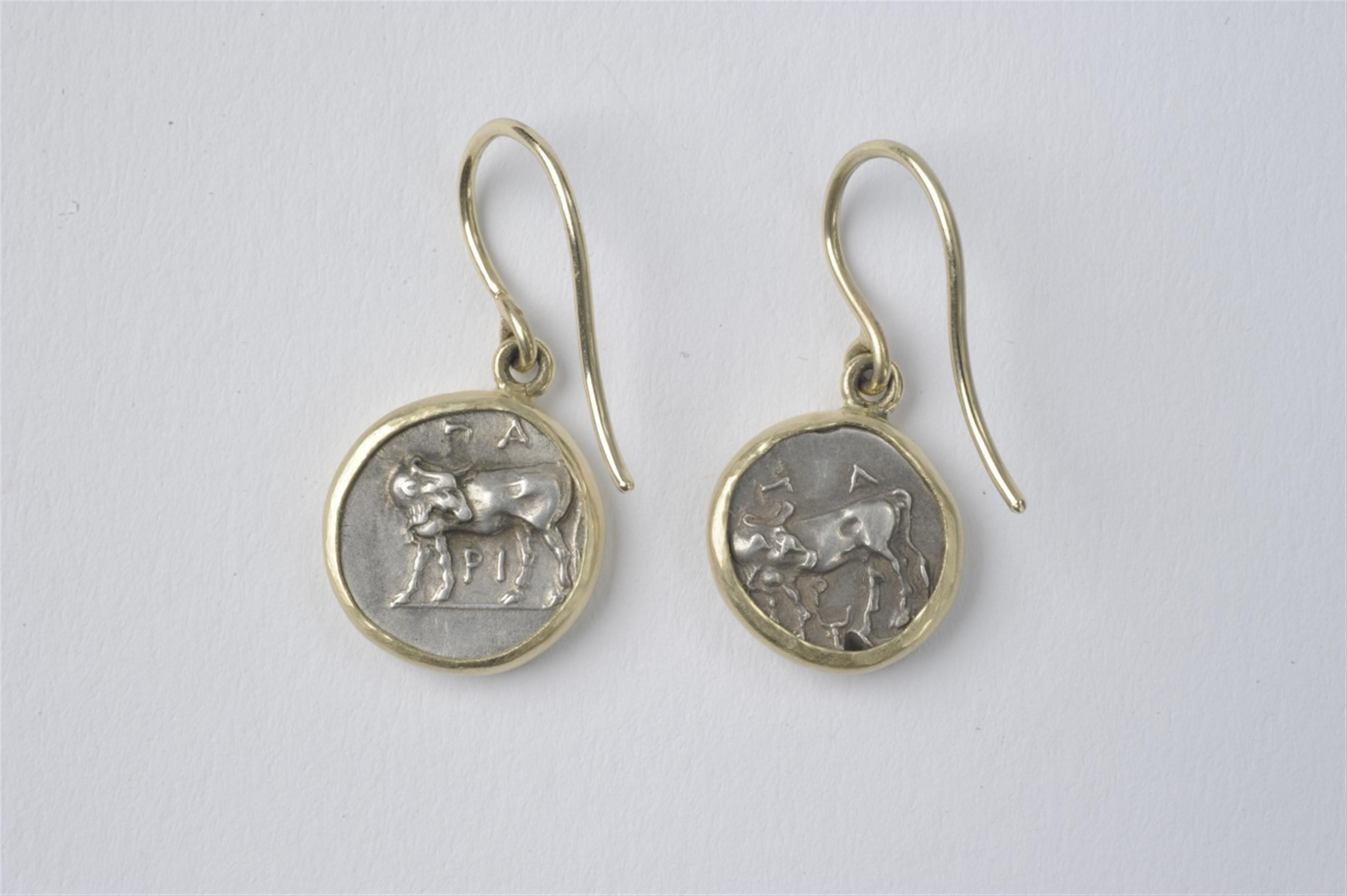 A pair of 14k gold pendant earrings with silver coins - image-2