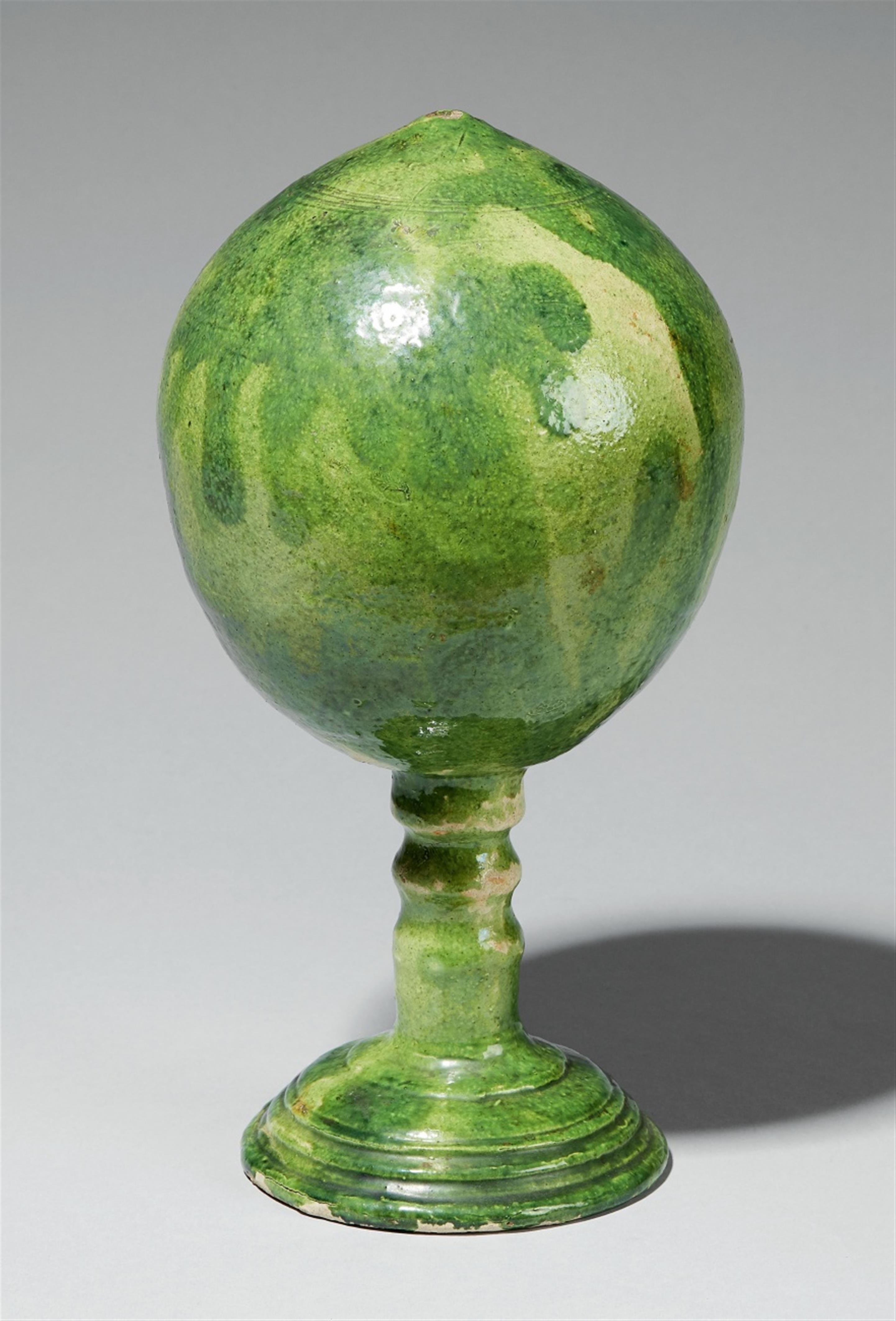 A Baroque green-glazed earthenware wig stand - image-1