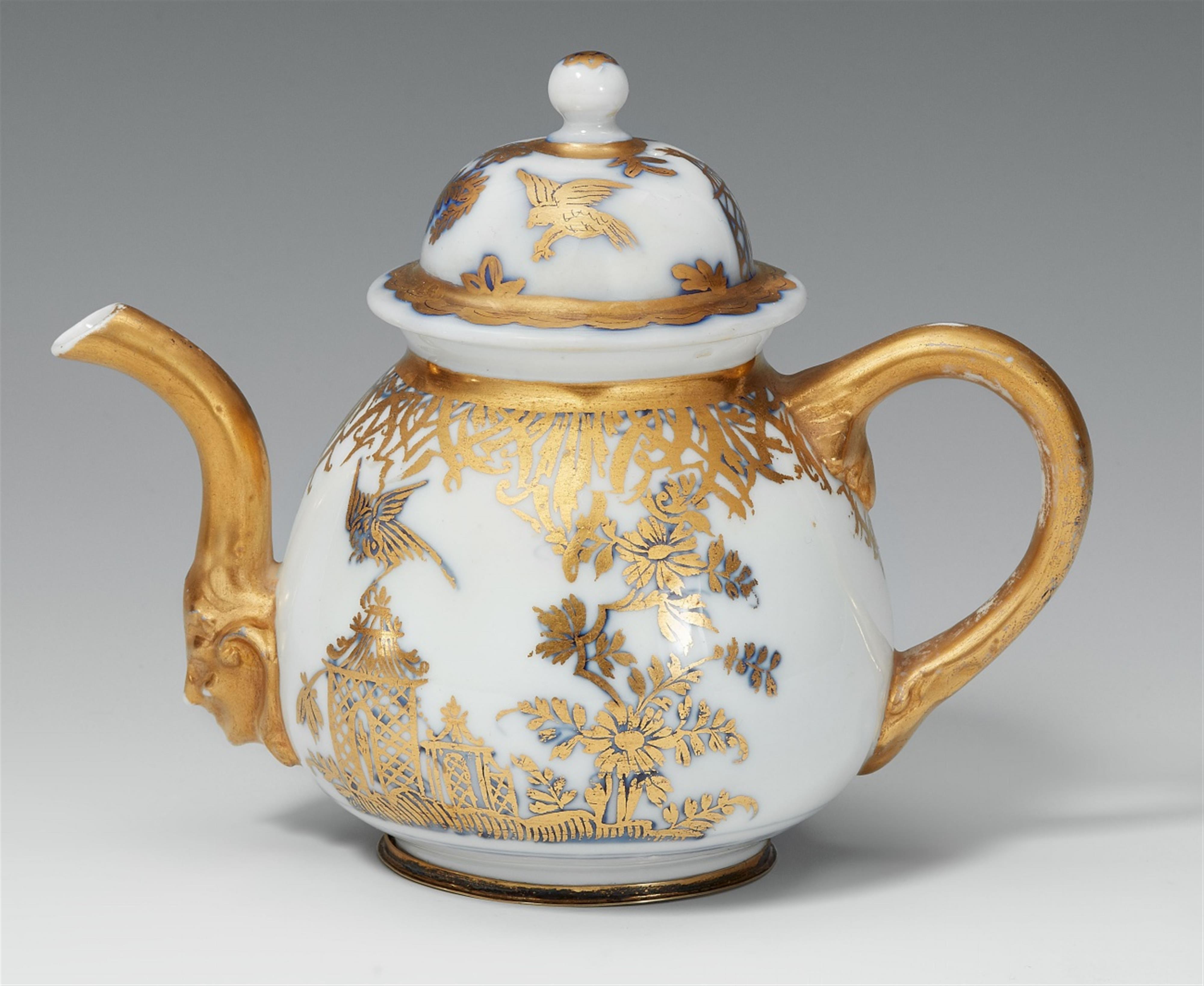 A Meissen porcelain teapot with bird and rock decor - image-1