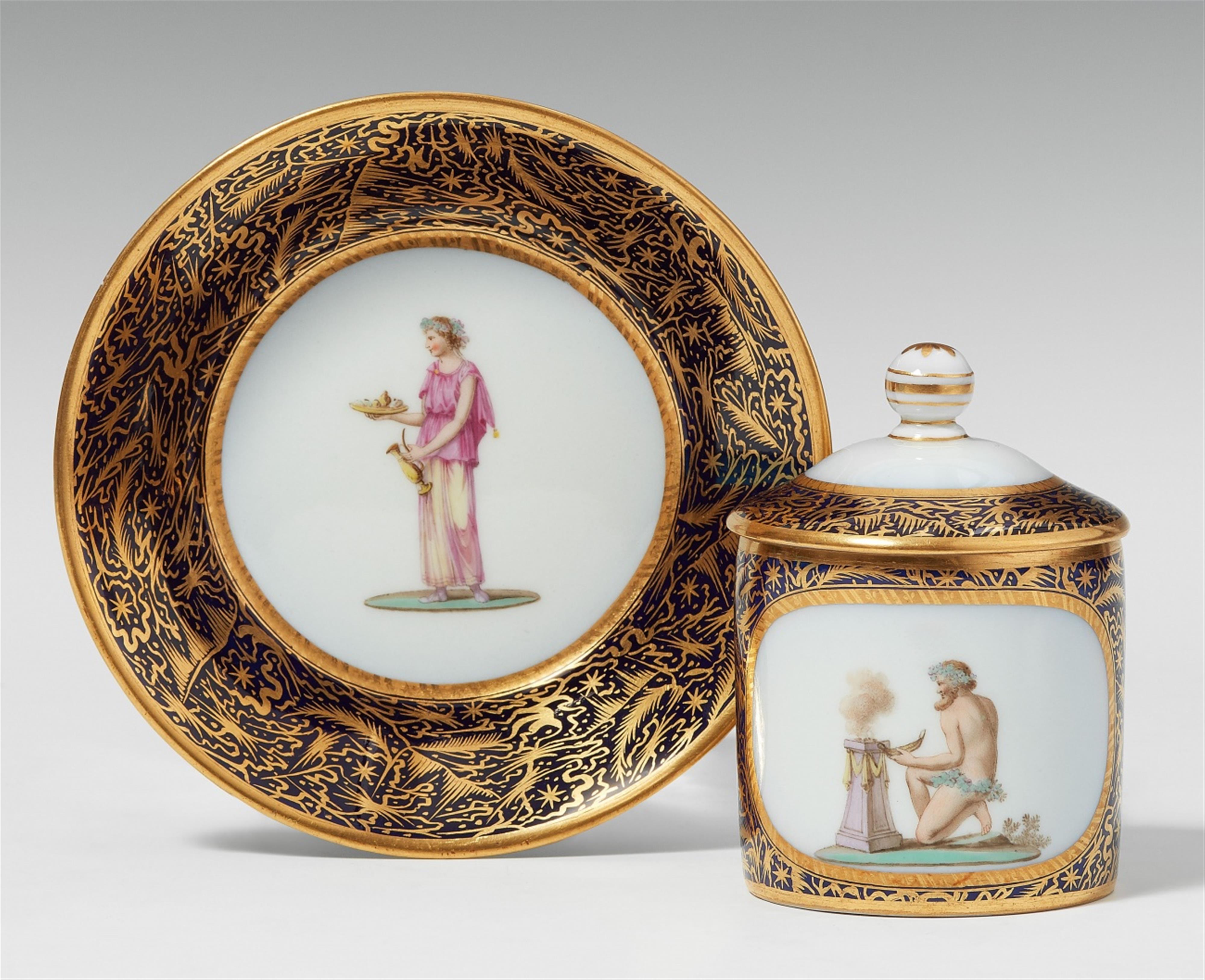A Berlin KPM porcelain cup and cover with sacrificial scenes - image-1
