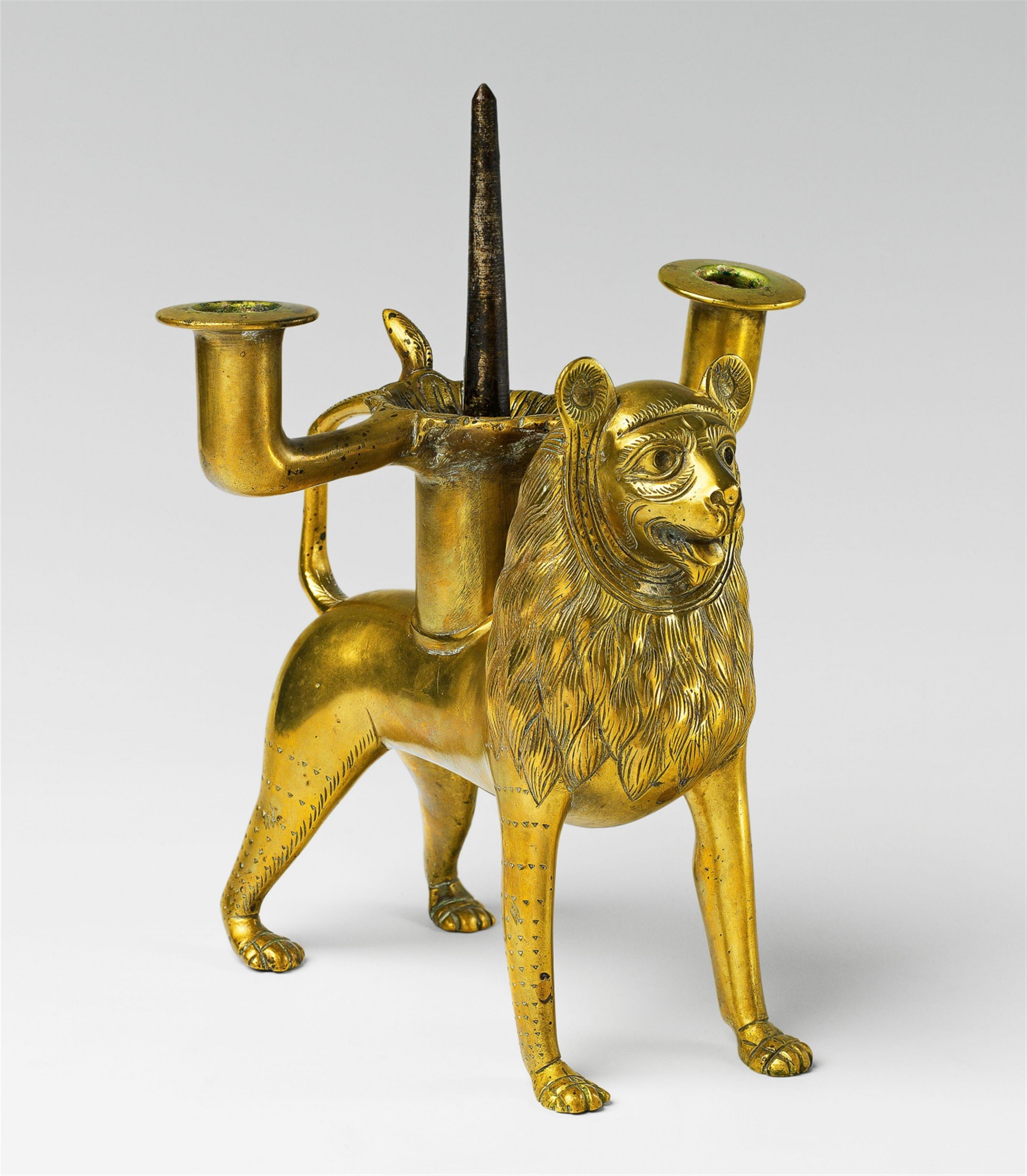 A medieval style brass candlestick formed as a lion - image-1