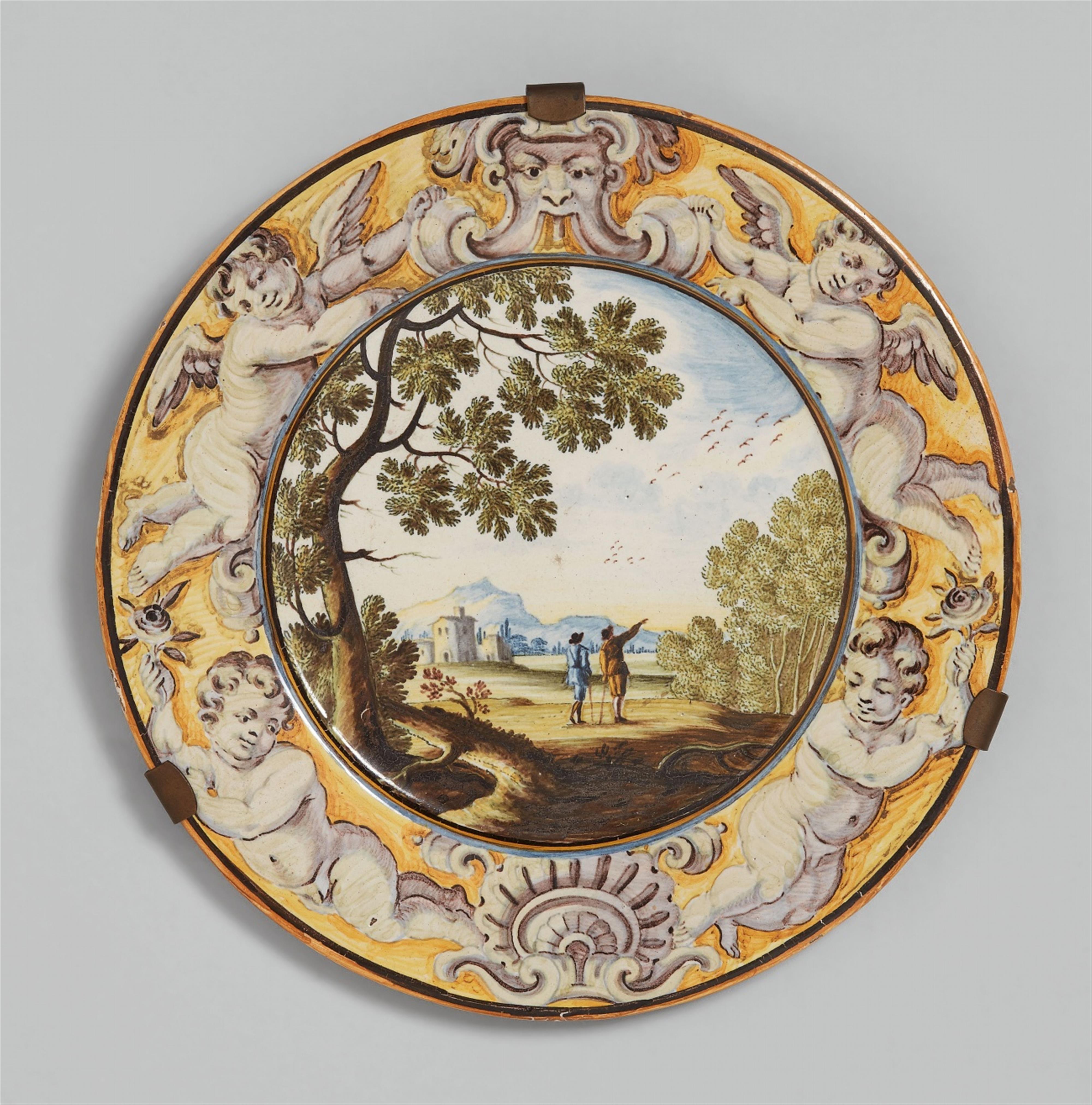 A small maiolica plate with landscape decor - image-1