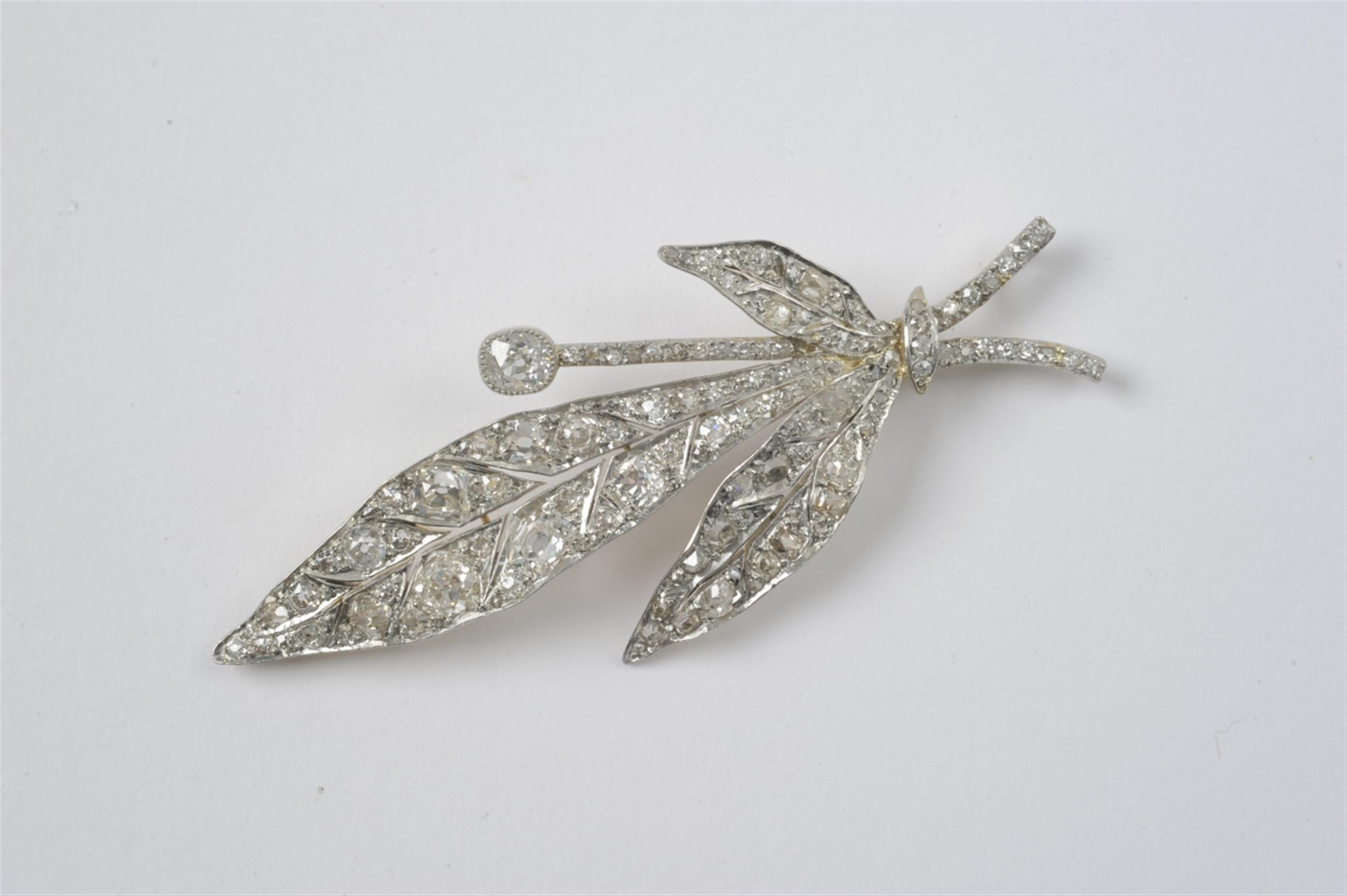 An 18k gold, silver and diamond brooch - image-1