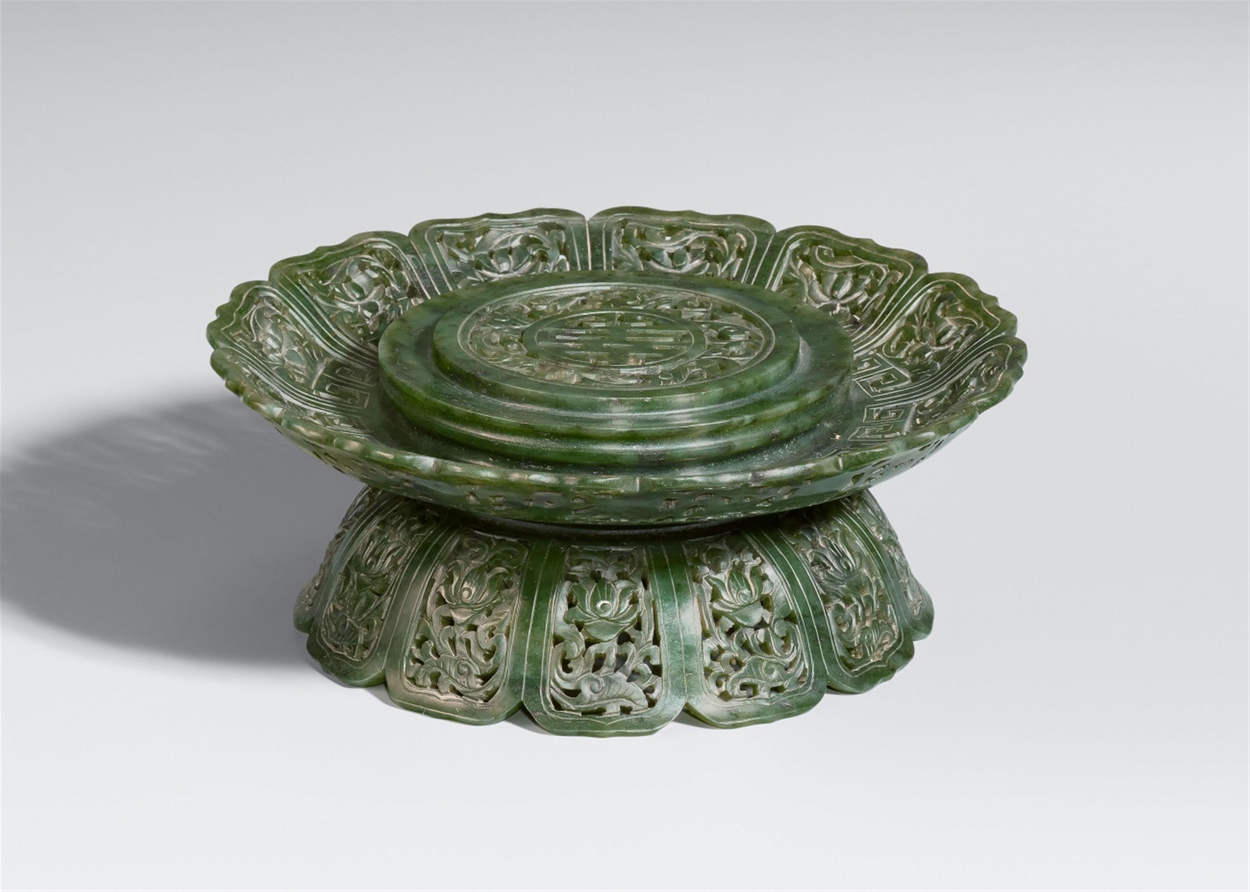 A spinach-green jade vase stand - image-1