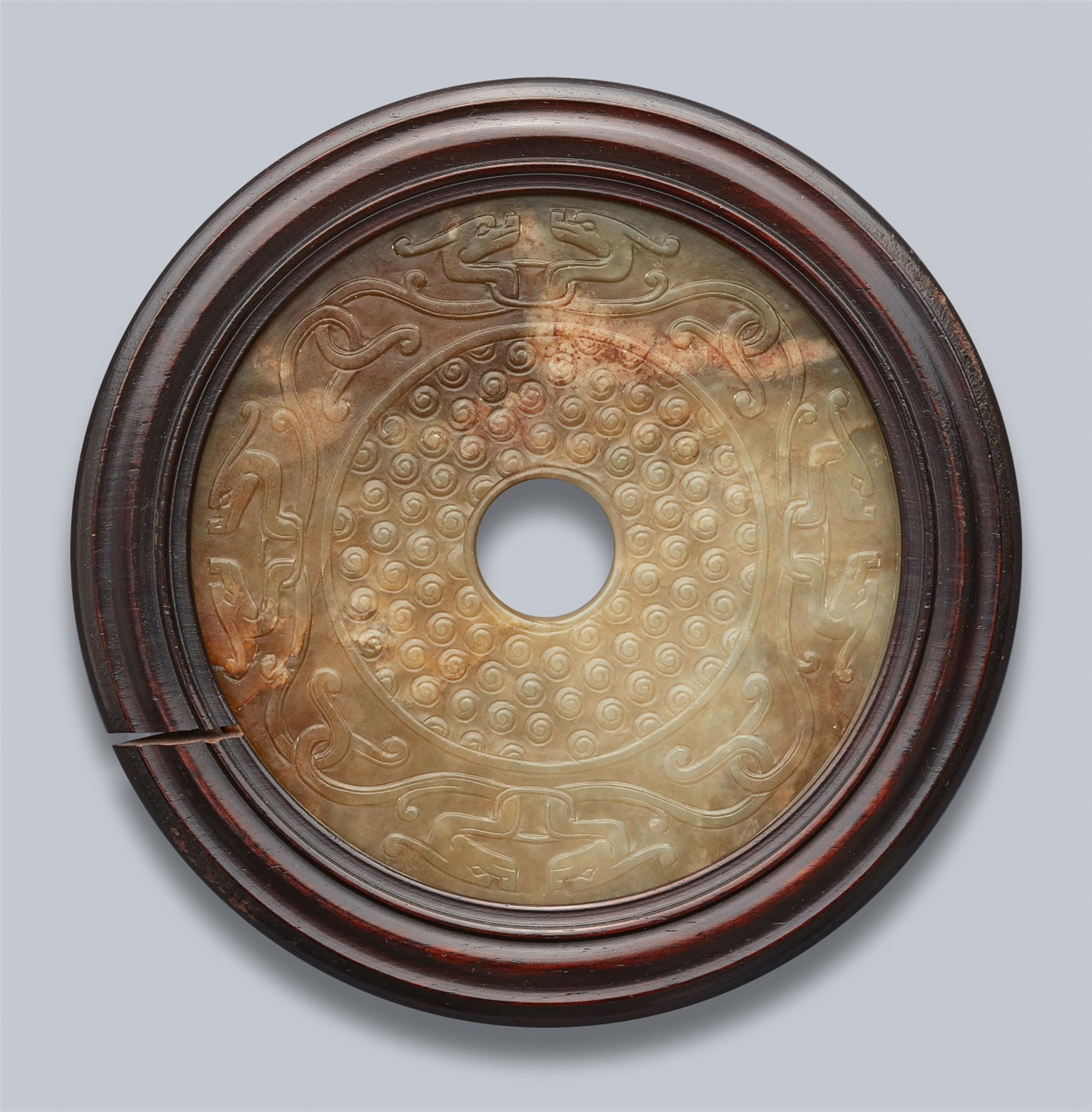 A green and brown jade bi disc. 19th century - image-1