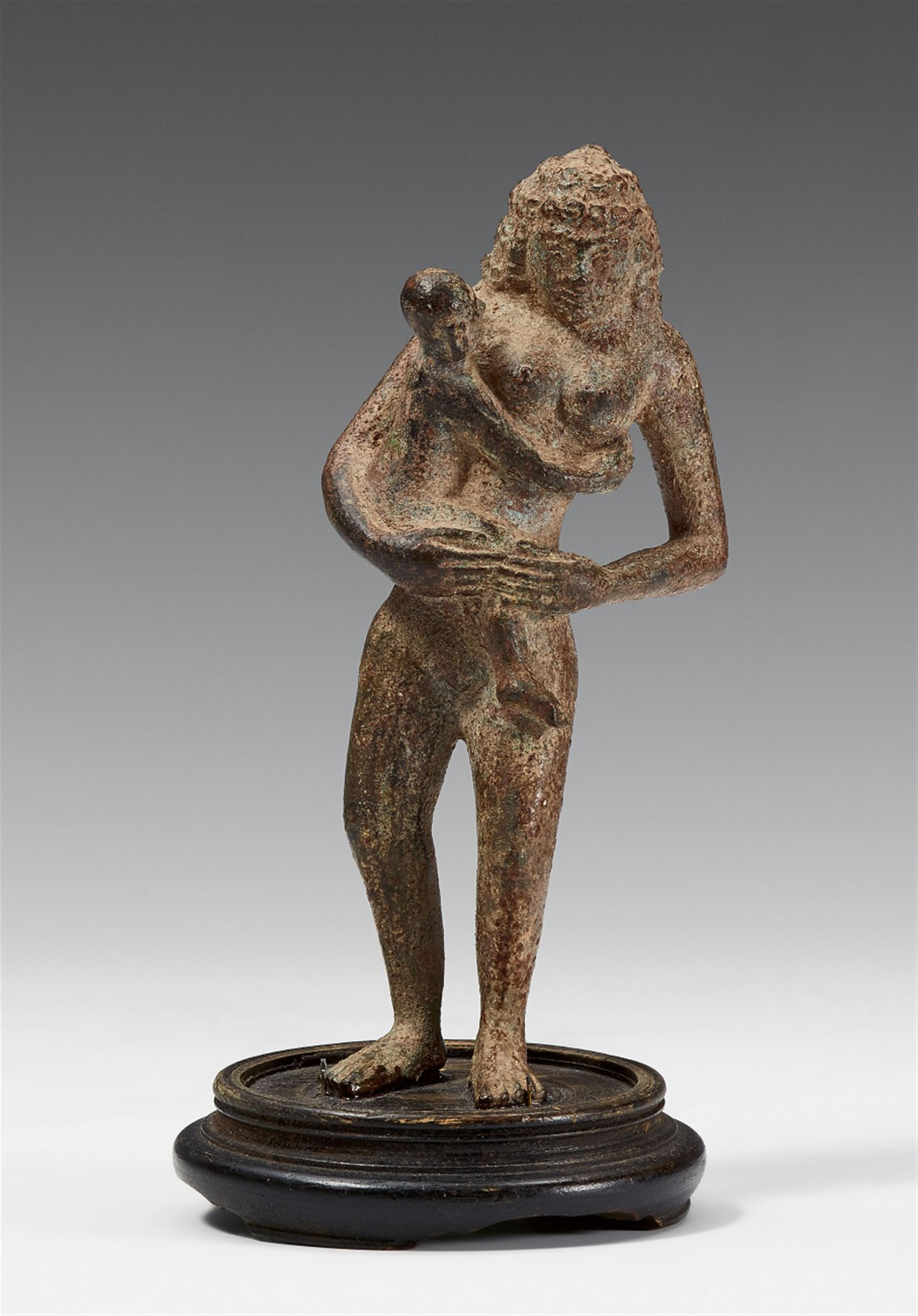 An unusual bronze figure of Hariti with a child - image-1