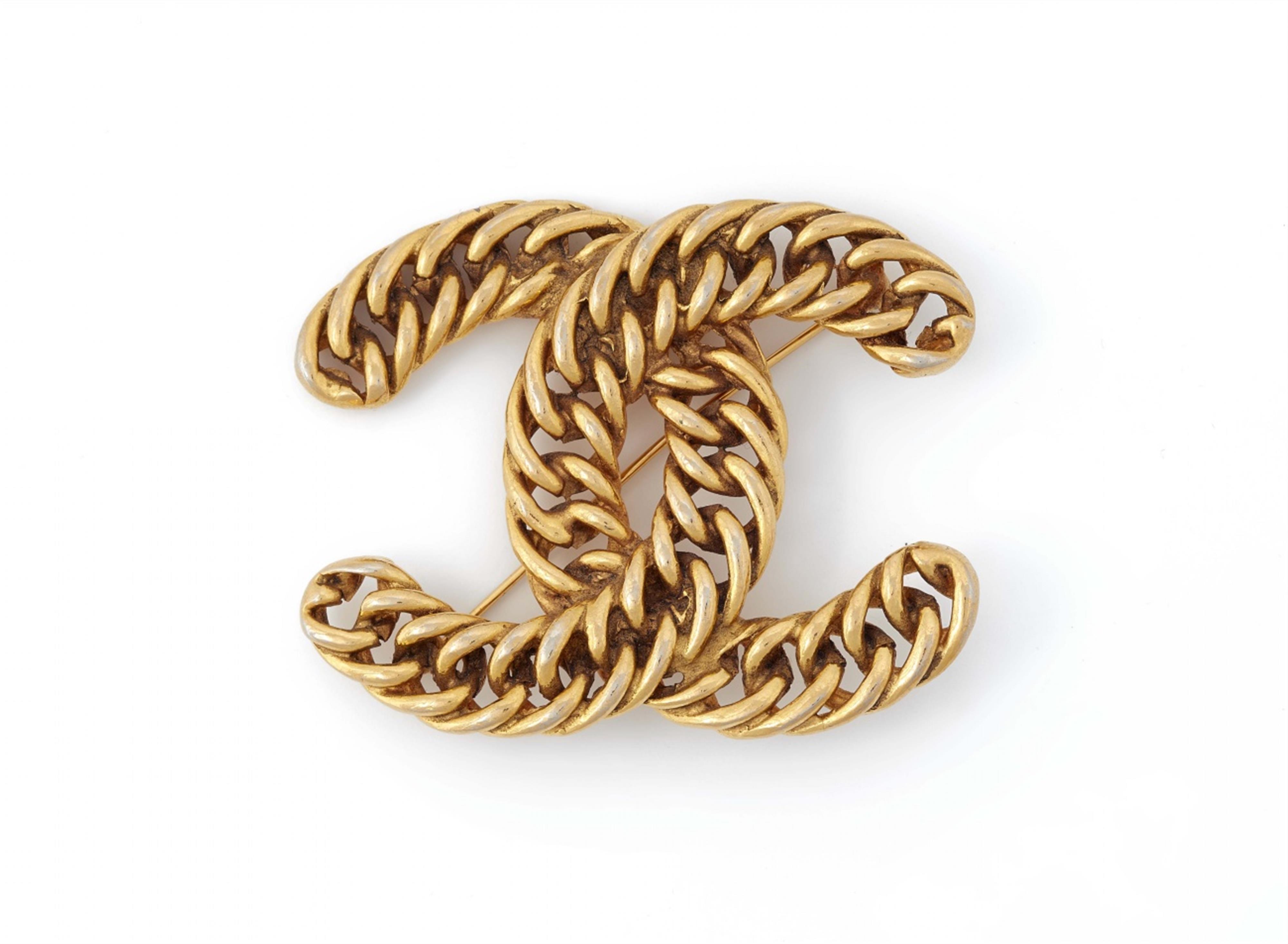 A Chanel logo brooch, 1982 - image-1