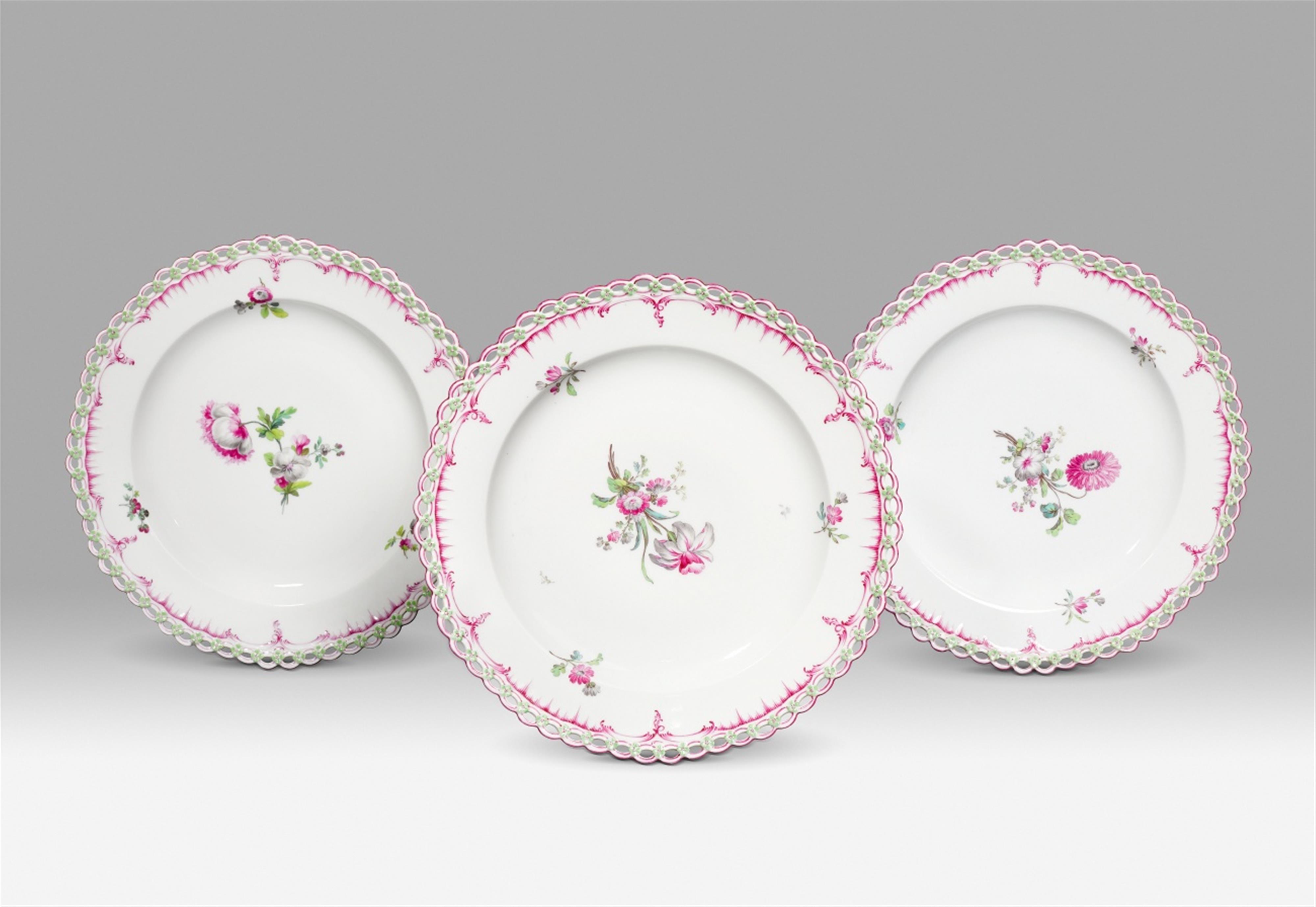 Three Berlin KPM porcelain plates with coloured flowers and puce borders - image-1