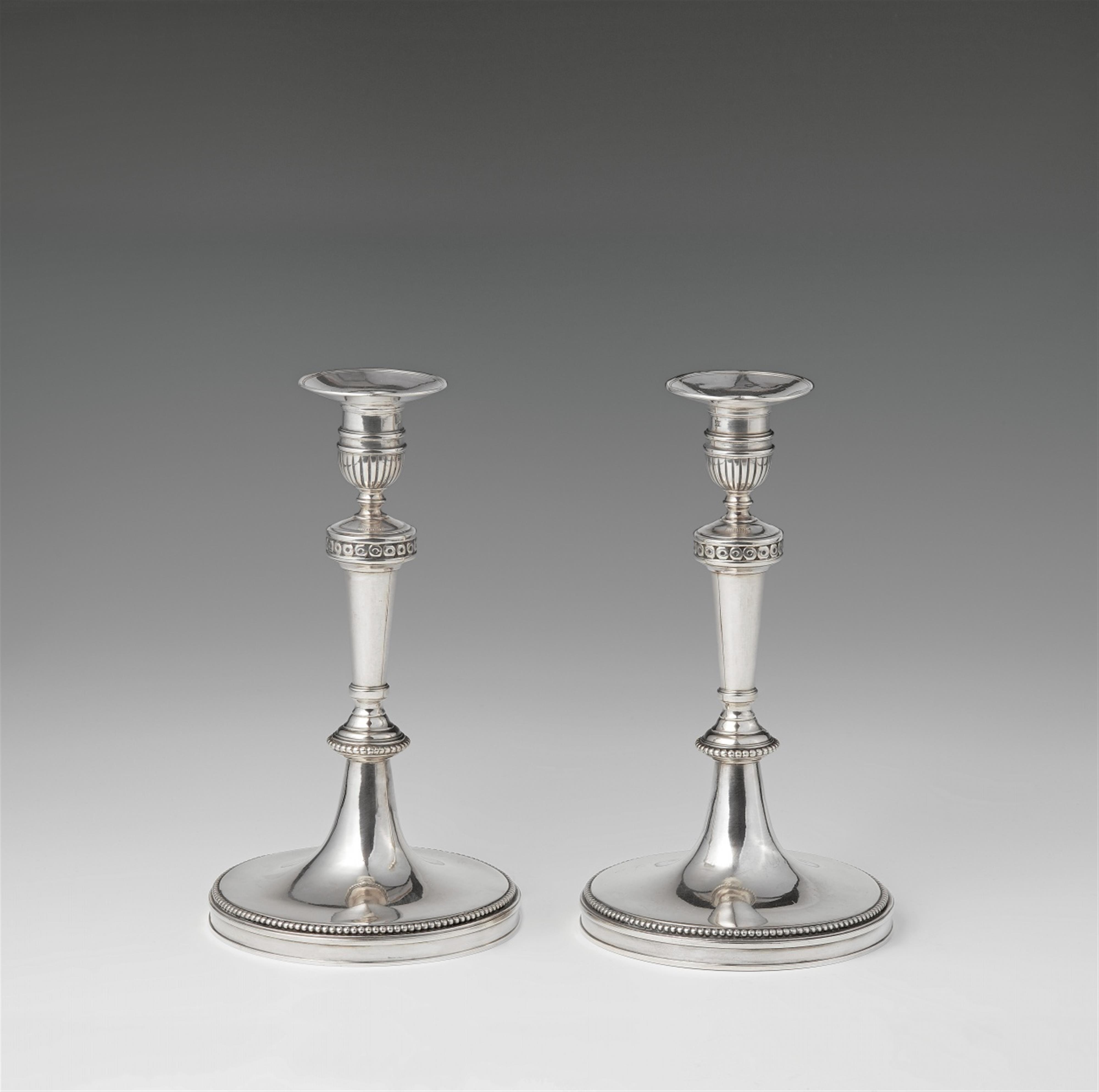 A pair of Vienna silver candlesticks - image-1