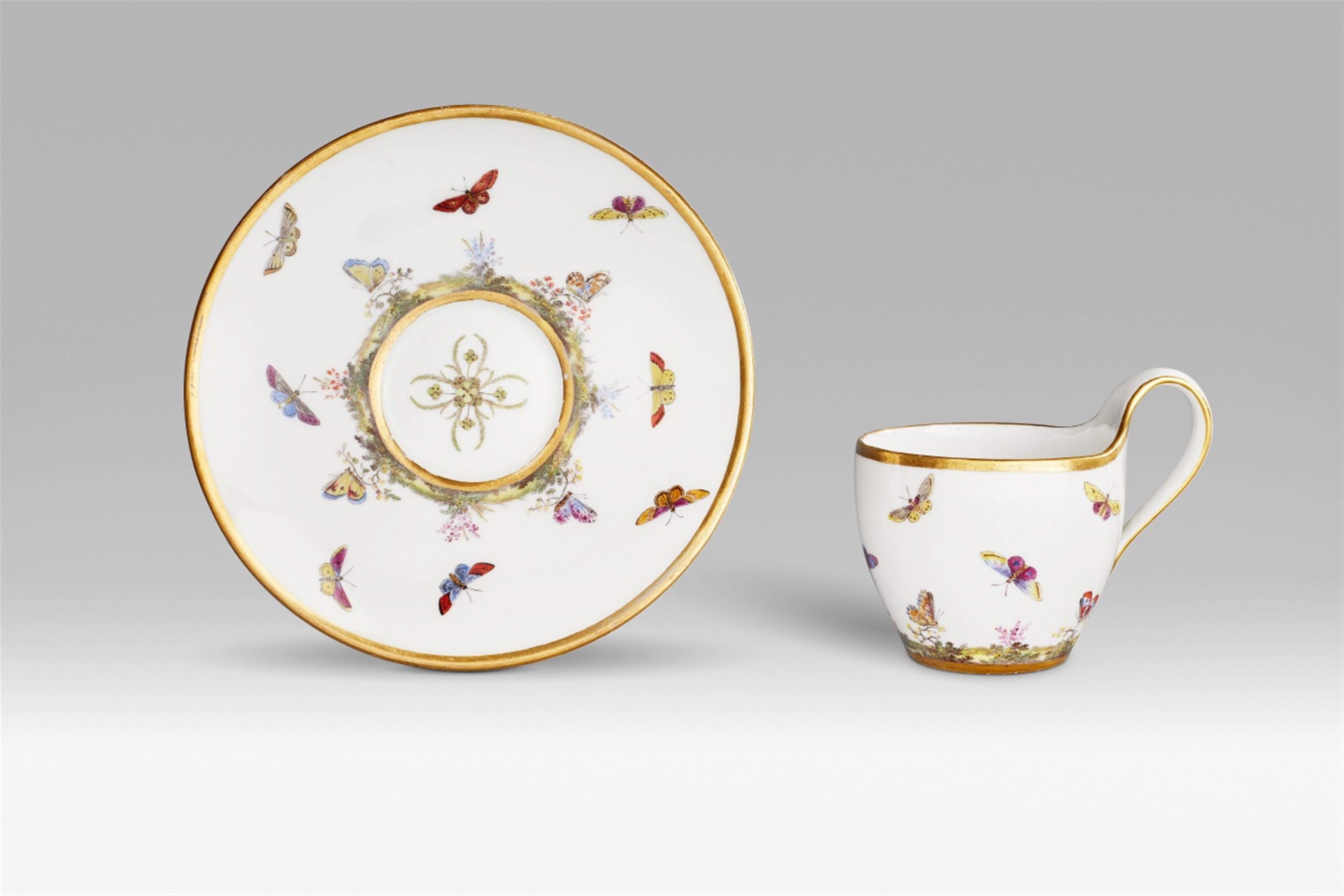 A Berlin KPM porcelain cup and saucer with insect decor - image-1