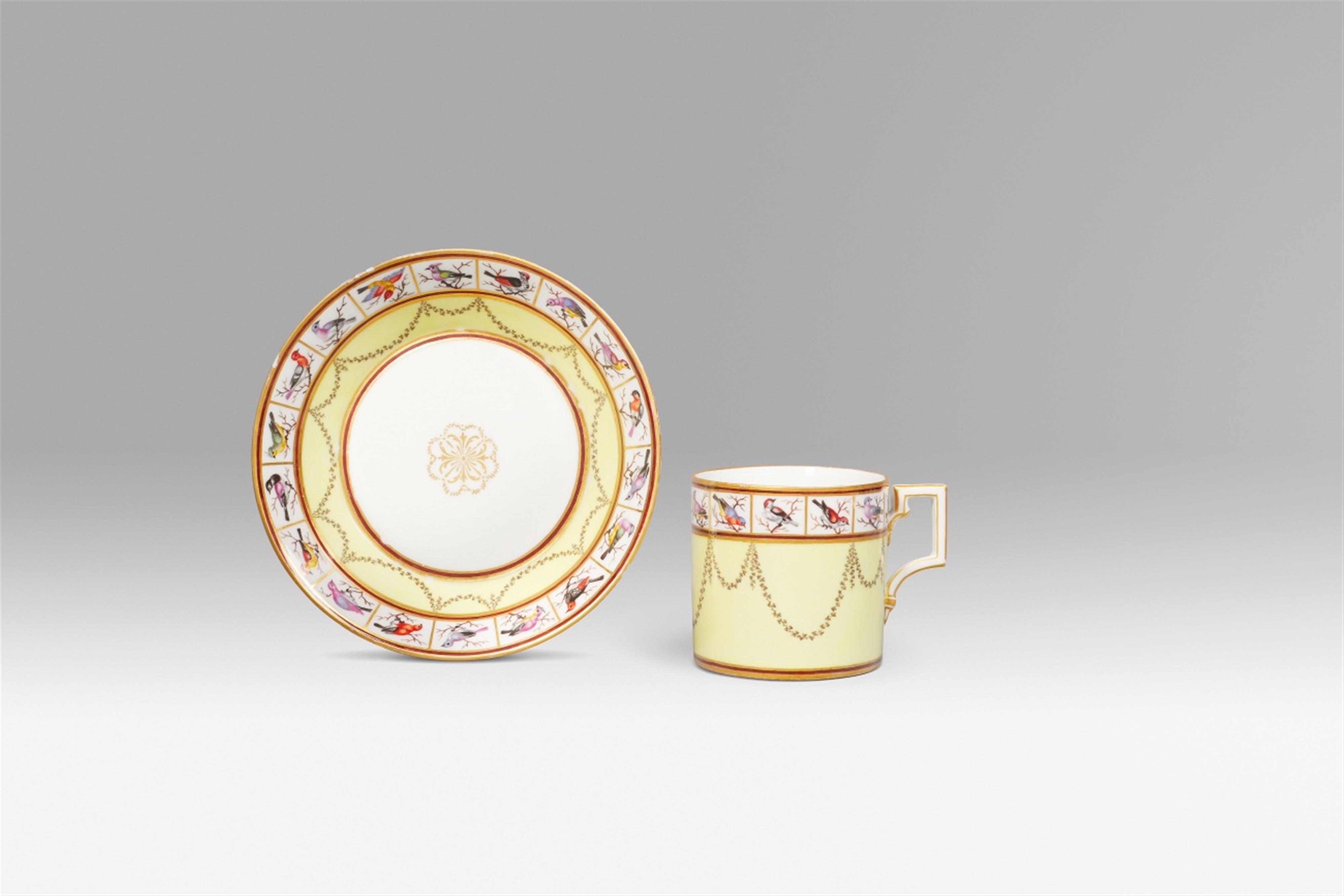 A Neoclassical Berlin KPM porcelain cup and saucer with yellow ground - image-1