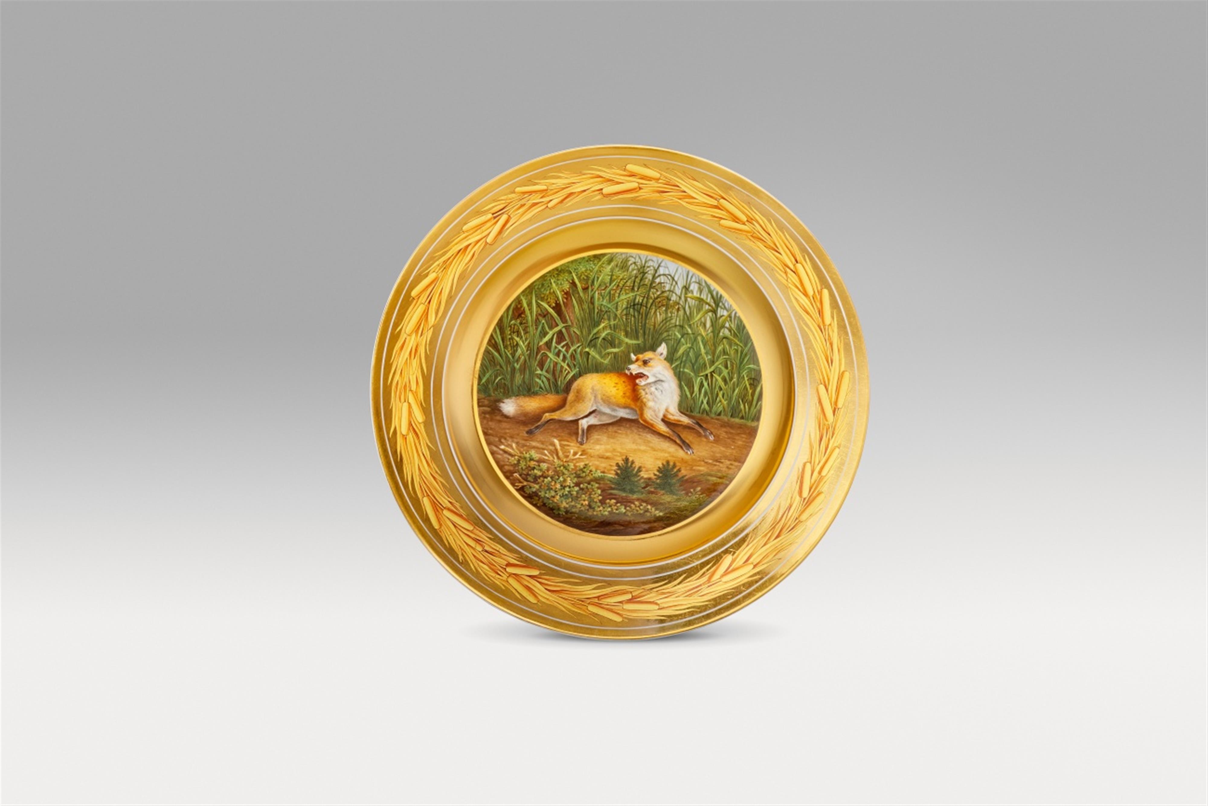 A Berlin KPM porcelain plate with a hunted fox - image-1