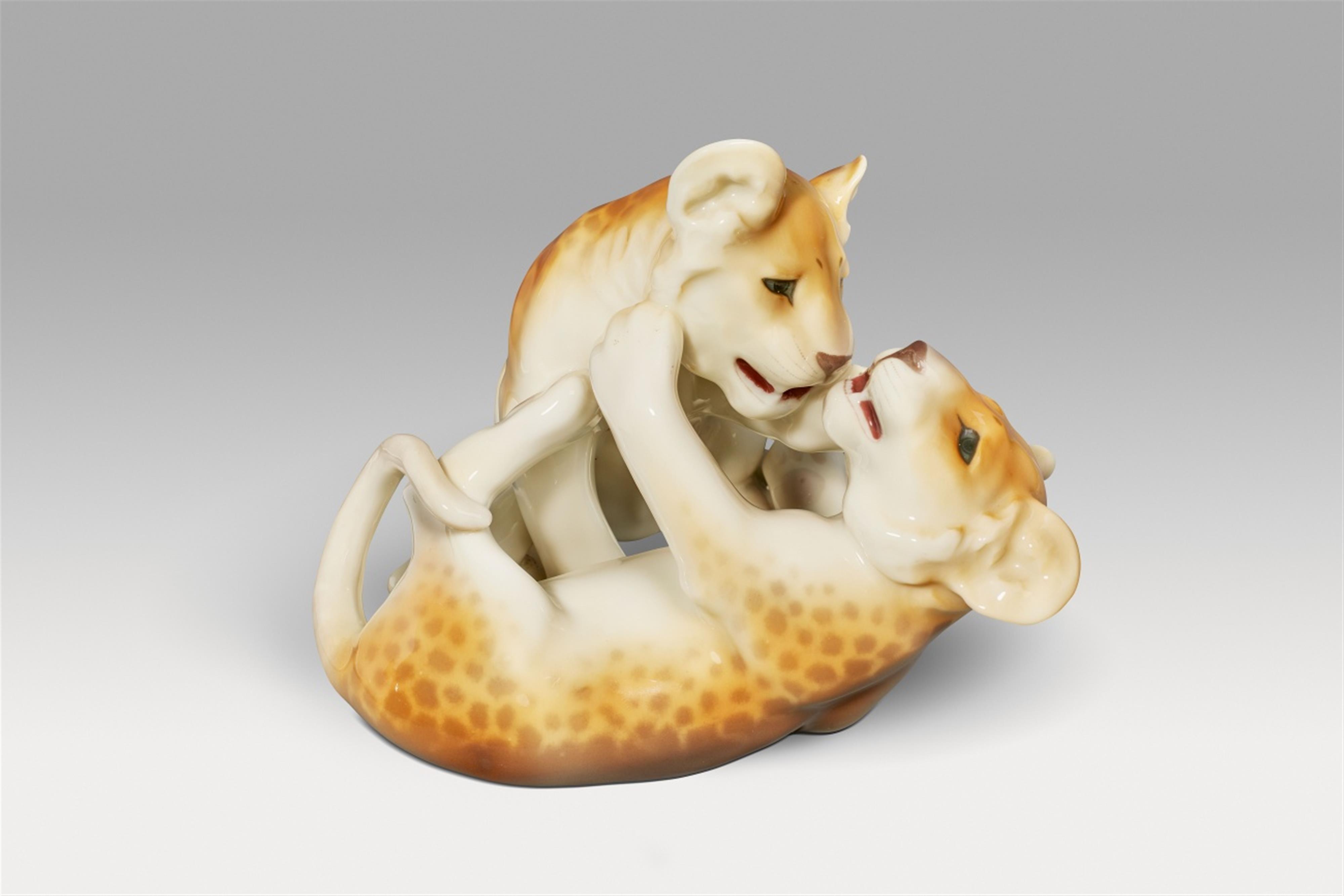 A Berlin KPM porcelain model of a young lion at play - image-1