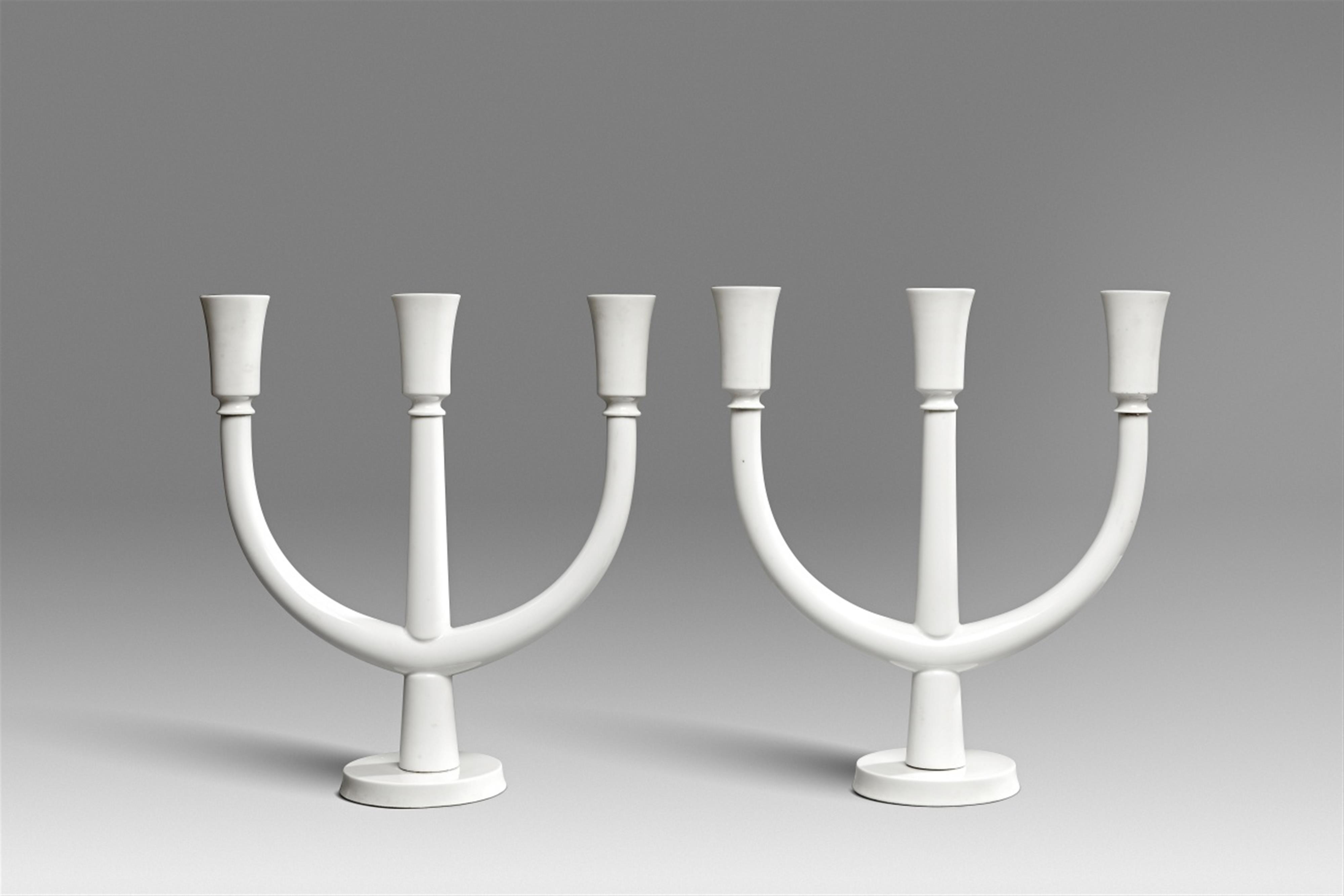 A pair of Berlin KPM white porcelain three-flame candelabra - image-1