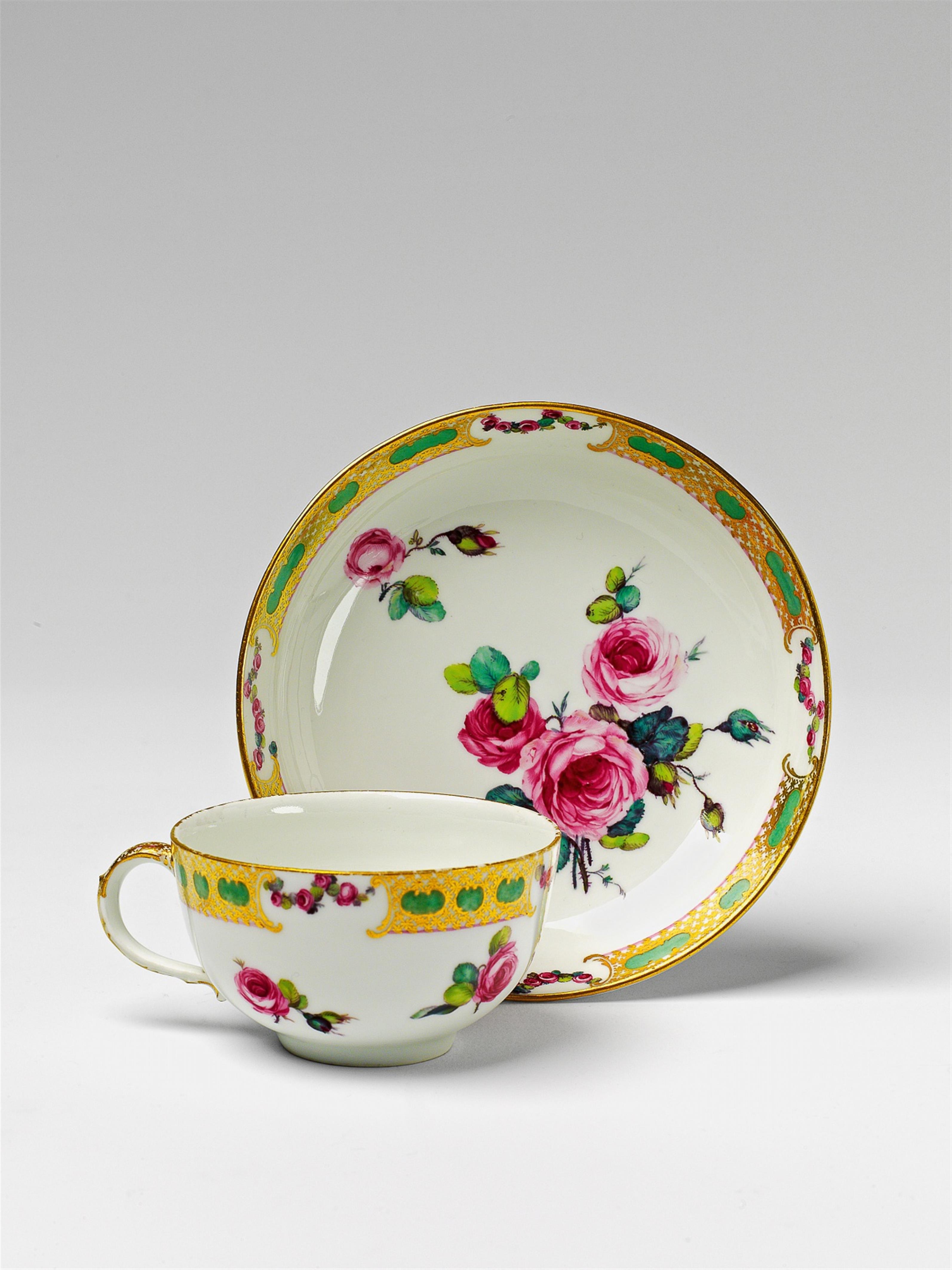 A Berlin KPM porcelain tea cup and saucer with rose swag decor - image-1