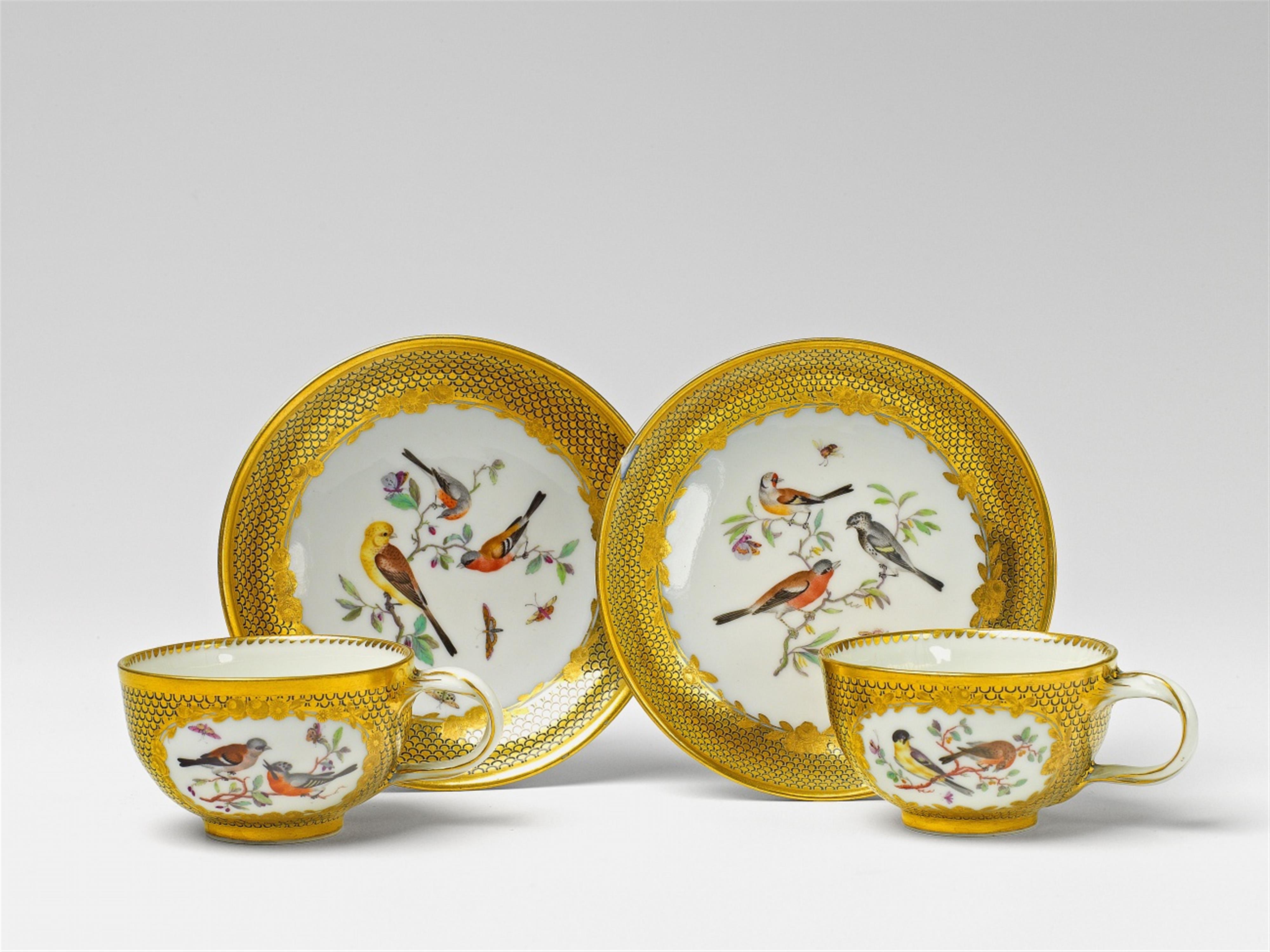 Two Berlin KPM porcelain teacups and saucers with bird decor - image-1