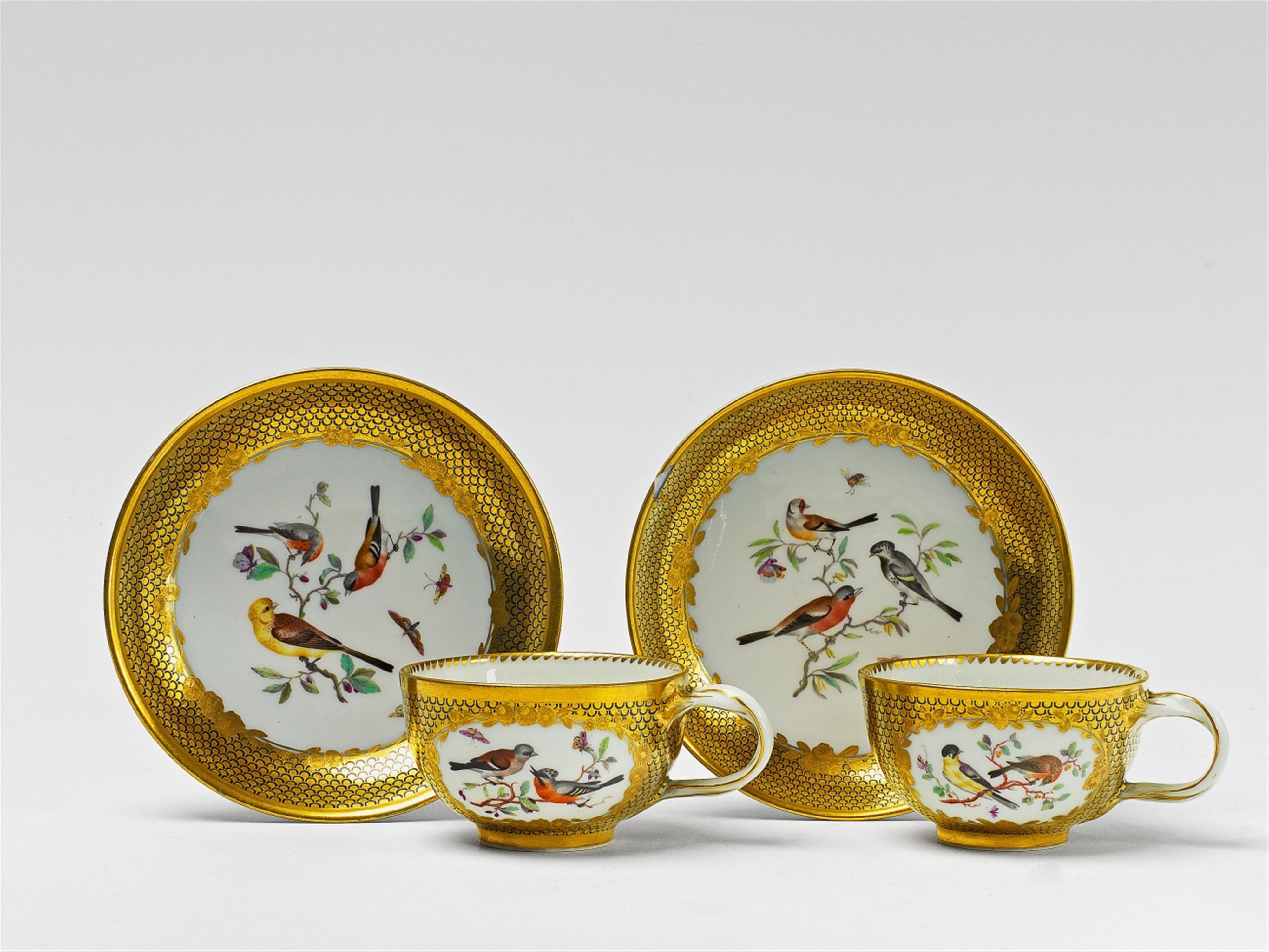 Two Berlin KPM porcelain teacups and saucers with bird decor - image-3