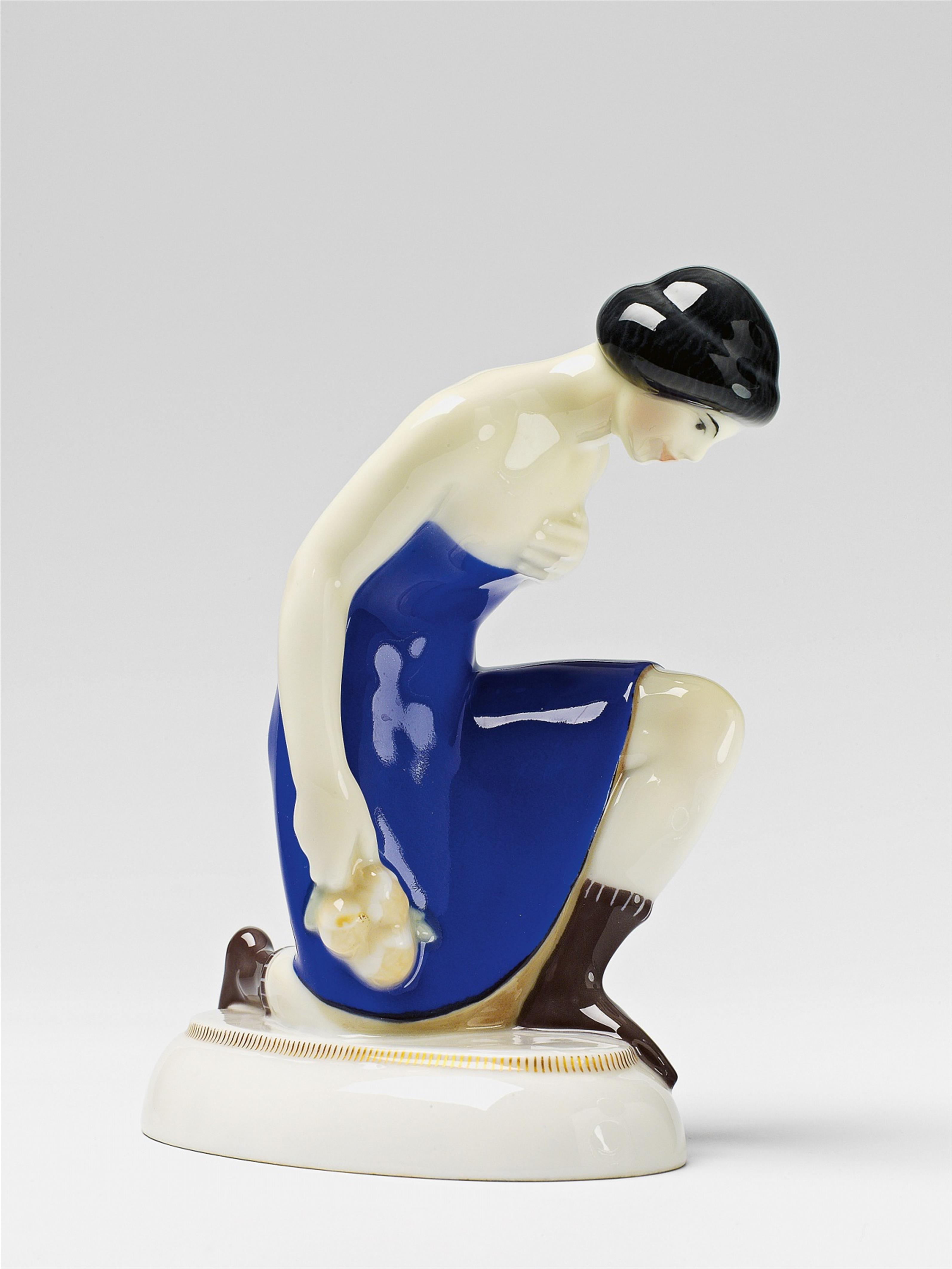 A Berlin KPM porcelain figure of a Kurdish youth with roses - image-1