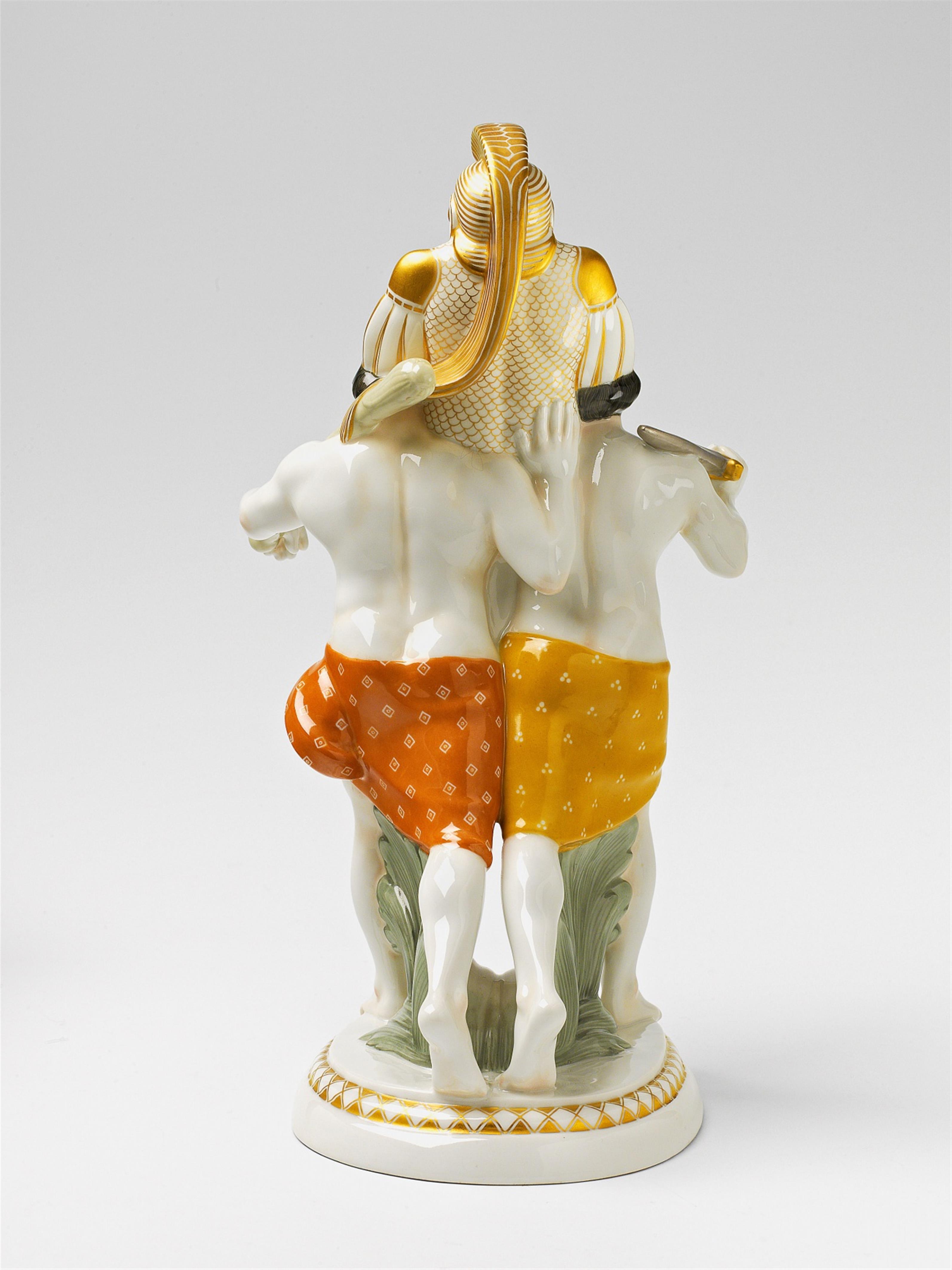 A Berlin KPM porcelain figure of two Etruscan men carrying a suit of armour - image-3