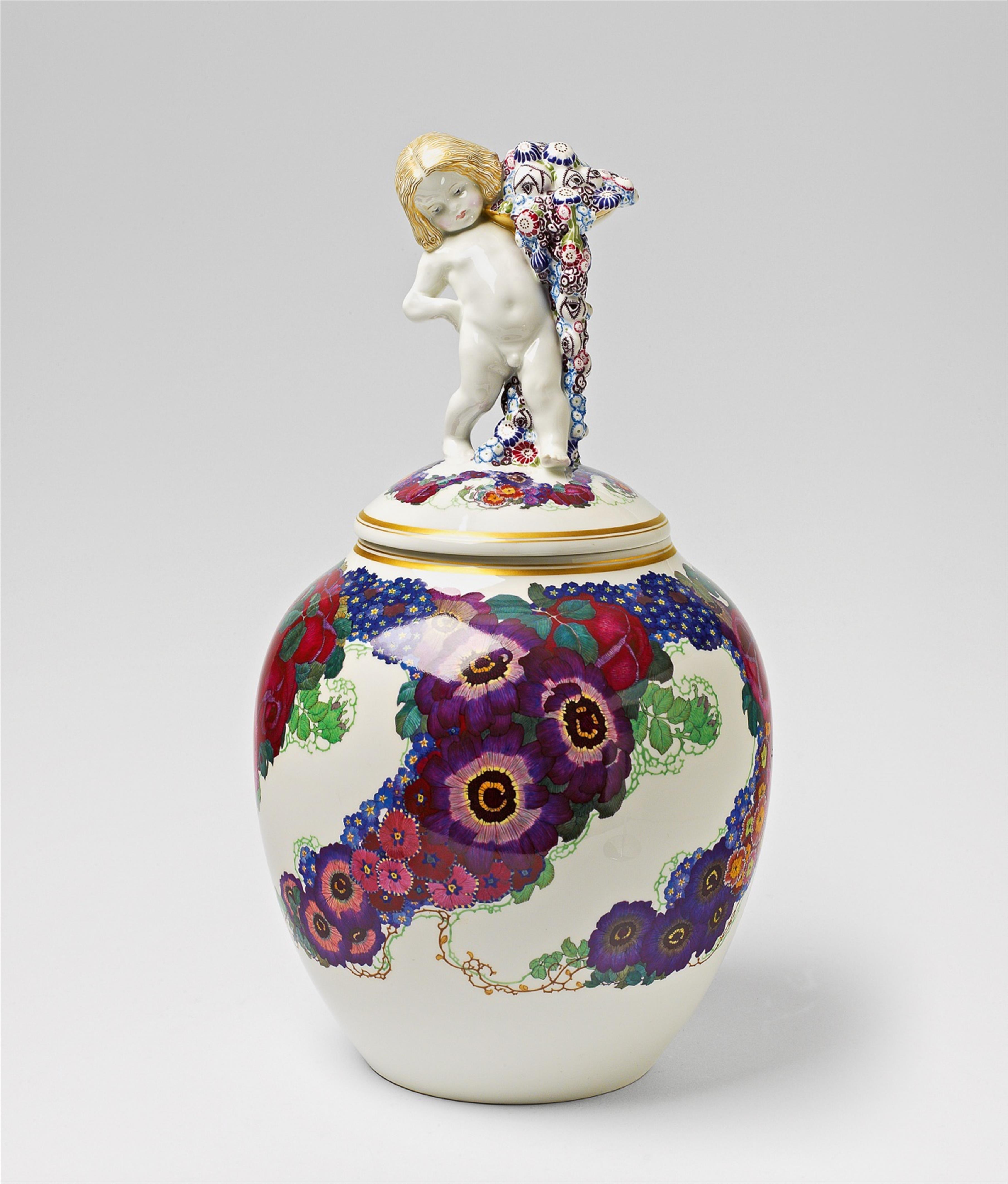 A Berlin KPM porcelain vase and cover with a putto finial - image-1